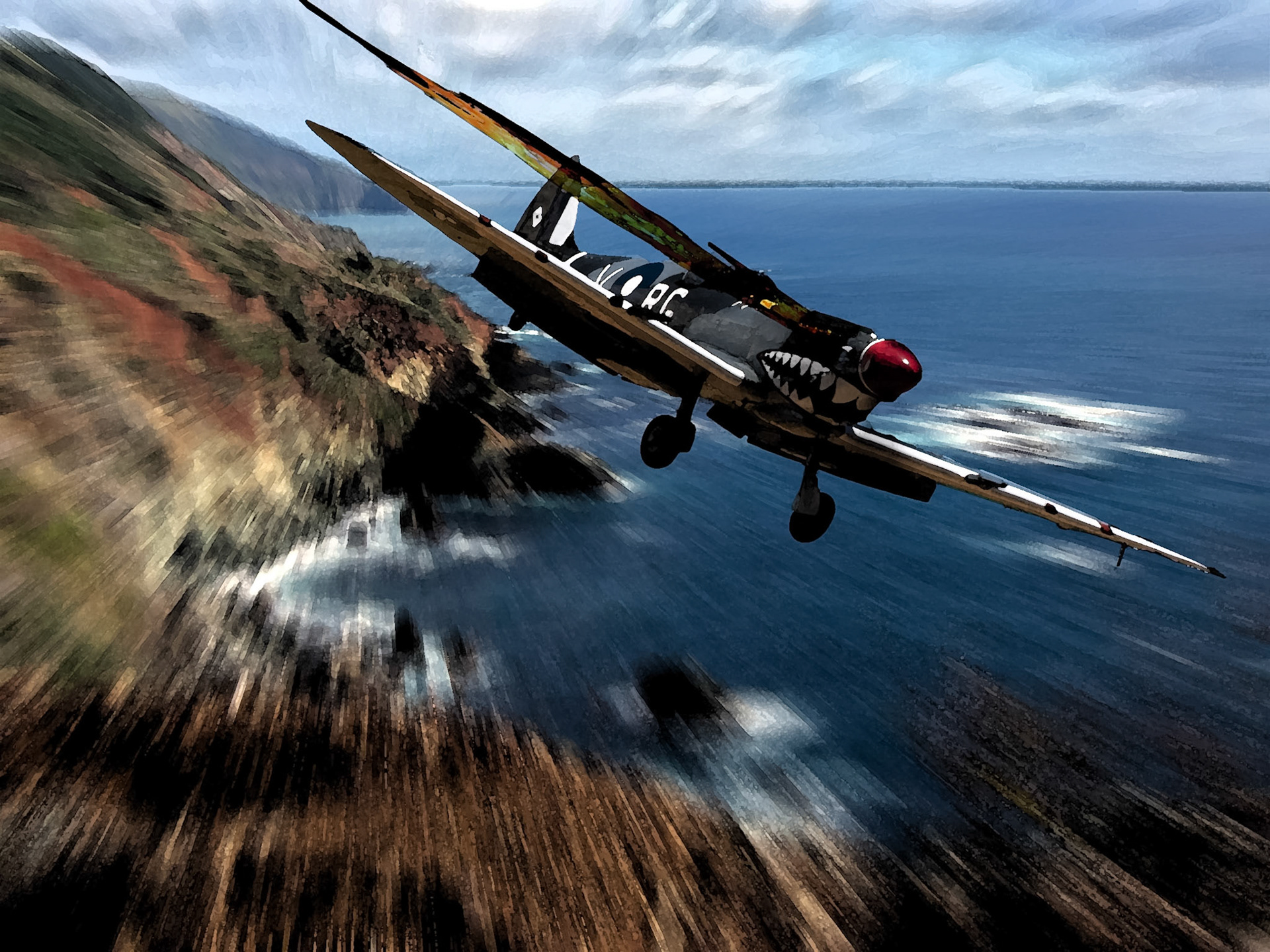 A low-flying Curtiss P-40 Warhawk aircraft with shark teeth nose art soars over a rugged coastline next to the ocean.