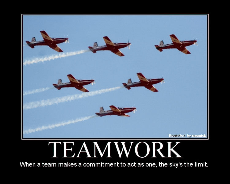 Six red and white airplanes fly in formation against a clear blue sky, leaving white smoke trails. The text below reads "TEAMWORK. When a team makes a commitment to act as one, the sky's the limit."