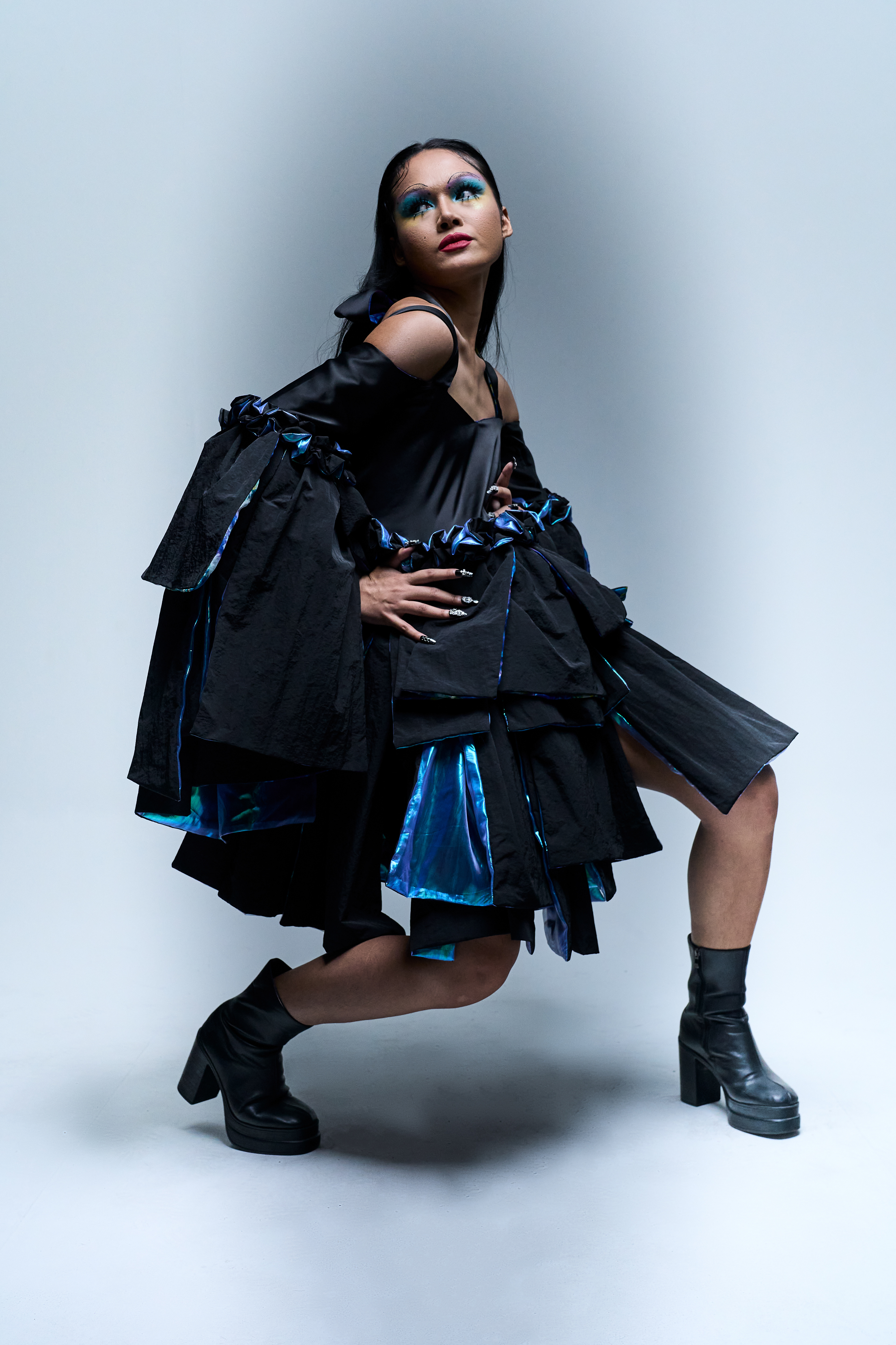 Raison d’être — Chromatic Ripple  Color in motion, form in transition.  A fashion editorial exploring fluid movement and tonal expression through layered color and silhouette. Shot in Bangkok for a Raffles International College mini collection.
