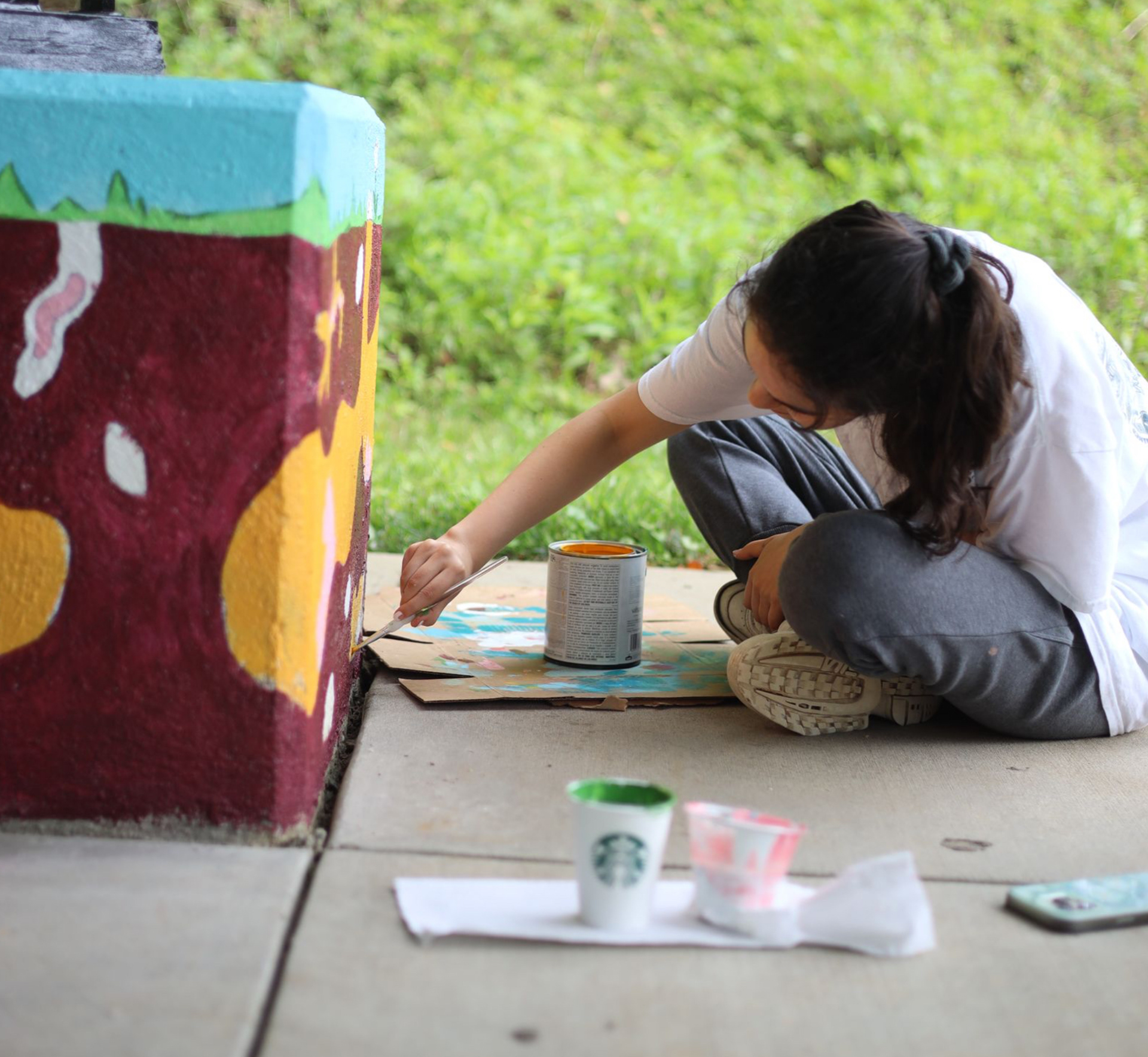 Painting the Bunny Burrow mural.