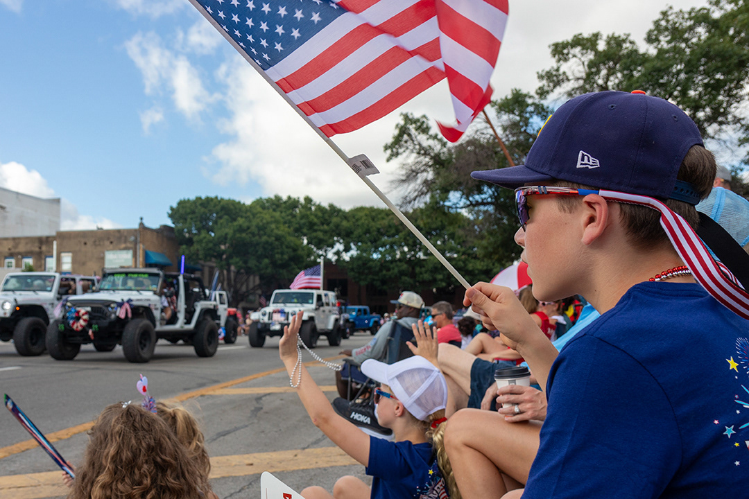 Attendees watch the Downtown July 4 Patriotic Parade at Main Plaza on July 4, 2024. BLAINE YOUNG | Herald-Zeitung