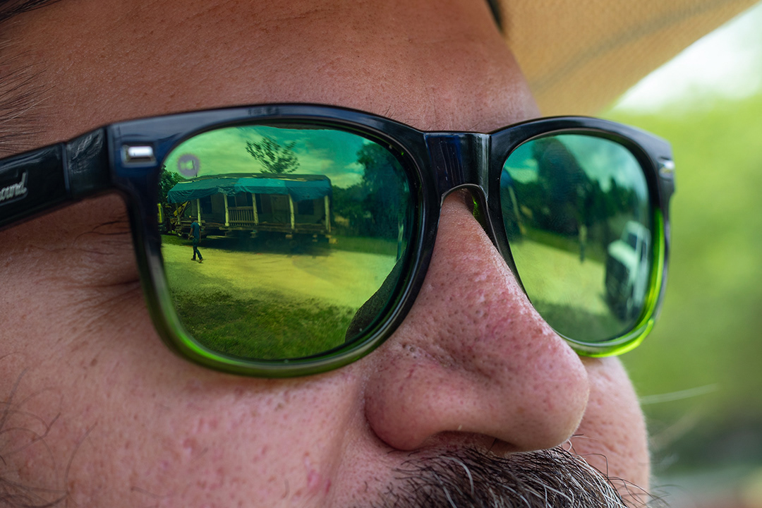 Justin Ball, curator for the Museum of Texas Handmade Furniture at Heritage Village, watches as the Braschler House is driven into Heritage Village on April 24, 2024. BLAINE YOUNG | Herald-Zeitung