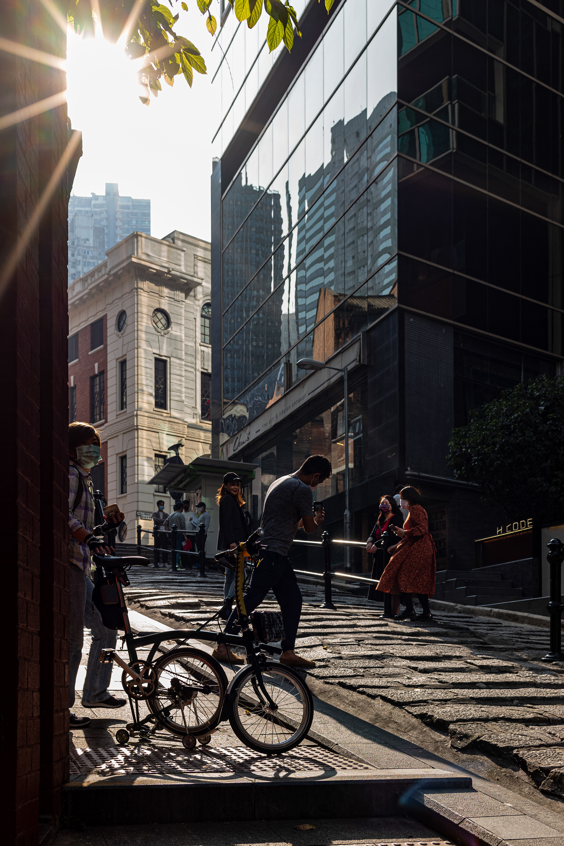 From wikipedia, "Pottinger Street is a street in Central, Hong Kong. It is also known as the Stone Slabs Street (Chinese: 石板街) since the street is paved unevenly by granite stone steps. It was named in 1858 after Henry Pottinger, the first Governor of Hong Kong, serving from 1843 to 1844.". Leica M10, Zeiss Biogon T* 2/35 ZM