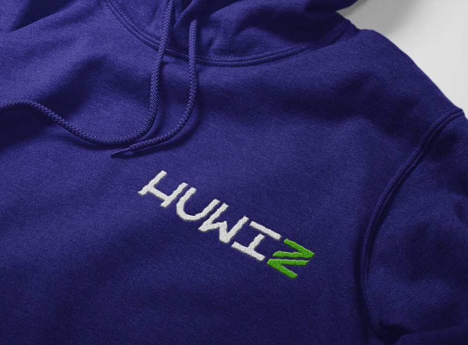 A purple hoodie with the company name written on the upper chest area. The logo is embroidered using the color white, and then green for the "z."