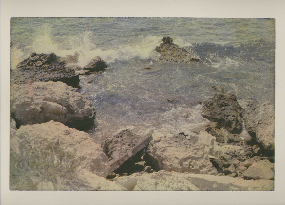 'Transit II' is a colour polymer photogravure by Jan Peeters, depicting the spot were a sailboat was shipwrecked, on the rocks of La Pointe Noire, a peninsula near La Couronne, Southern France.