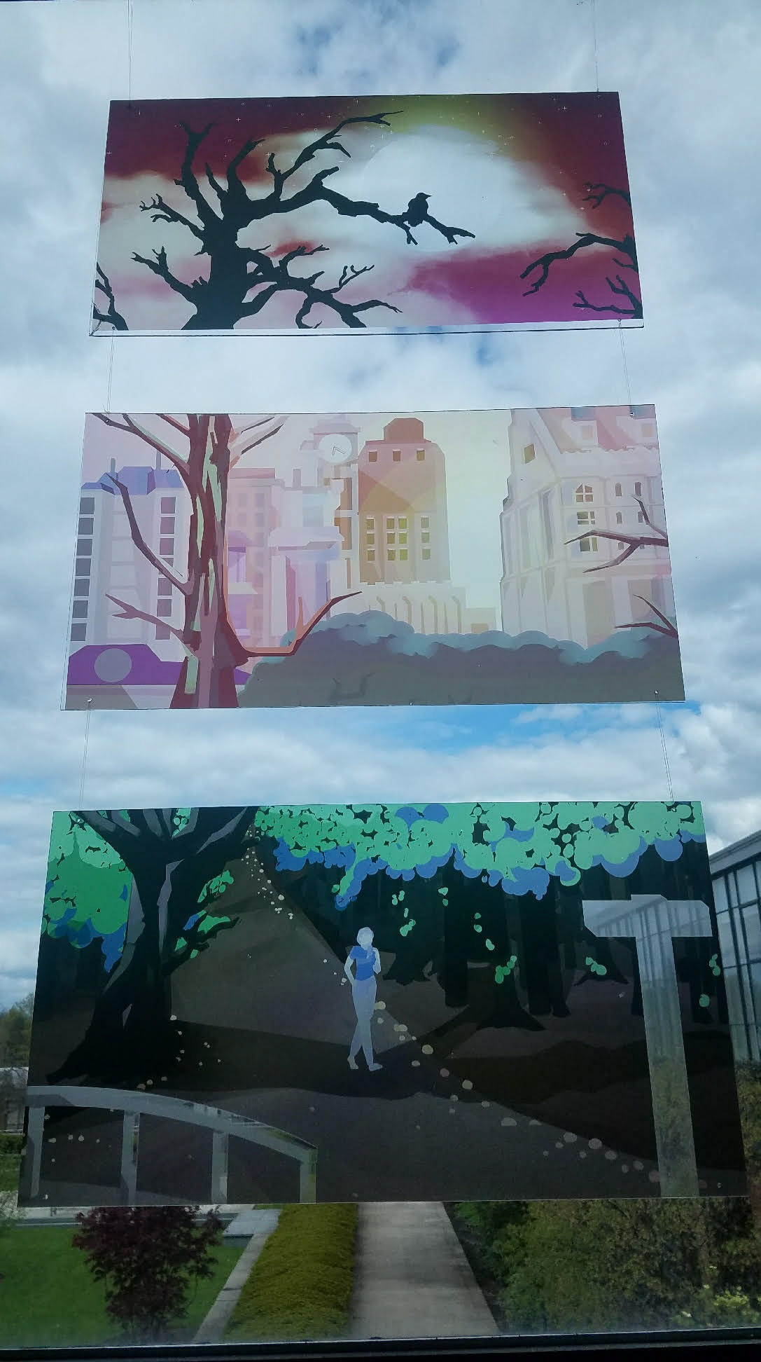 Tree Triptych - A series of three images printed onto plexiglass. Each image has tree and a light source. The tree is to connect the images vertically, and the light source synergizes with the transparent glass the piece is made of. When hung in front of a sun facing window, the light sources are lit appropriately.