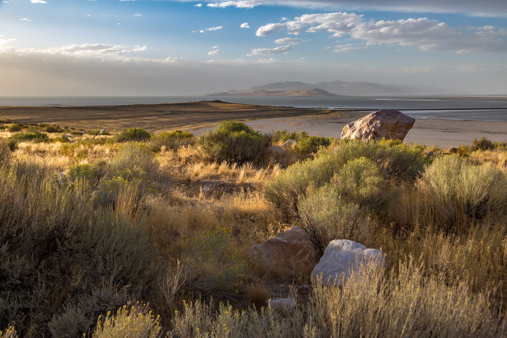 180915_196 Boulders in the prairie grasslands along the shoreline of Great Salt Lake in the Antelope Island State Park near Syracuse, Utah