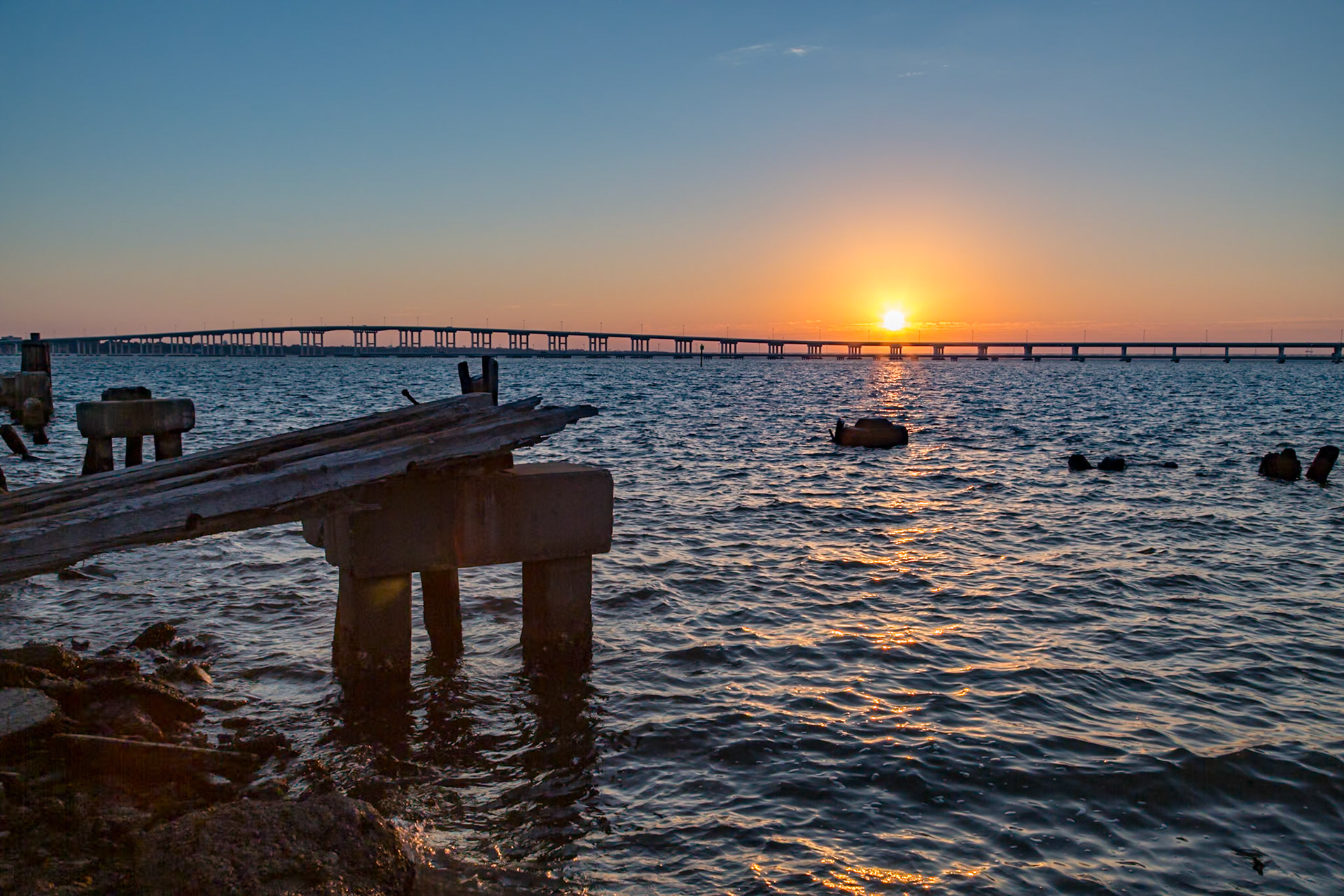 141122_032 Biloxi Bay Bridge behind the remains of an old gantry crane track on the Back Bay in Biloxi, Mississippi