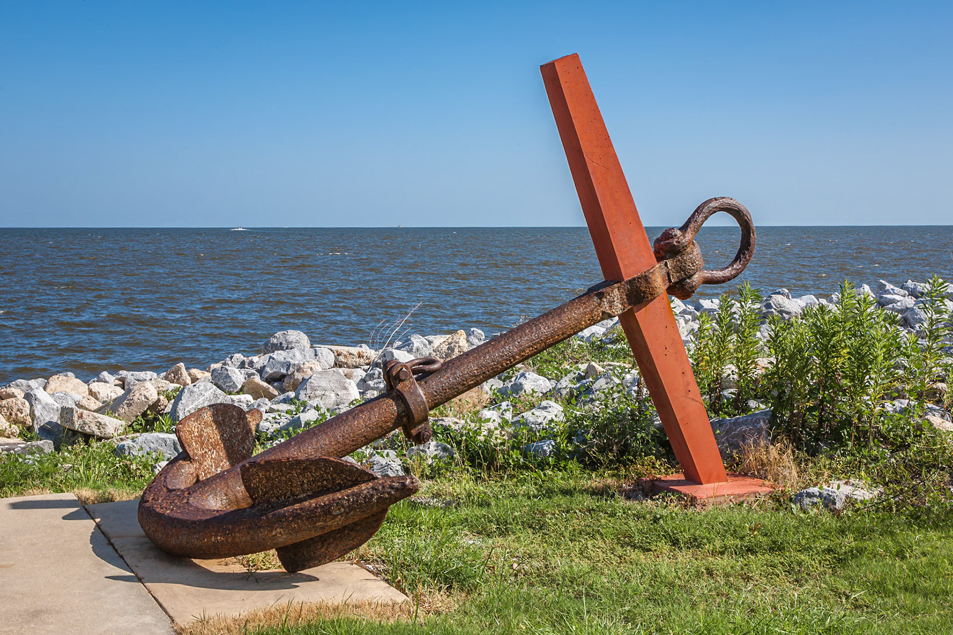 140617_555 Old ship anchor monument along the seawall of the Pass Christian Yacht club in Pass Christian, Mississippi