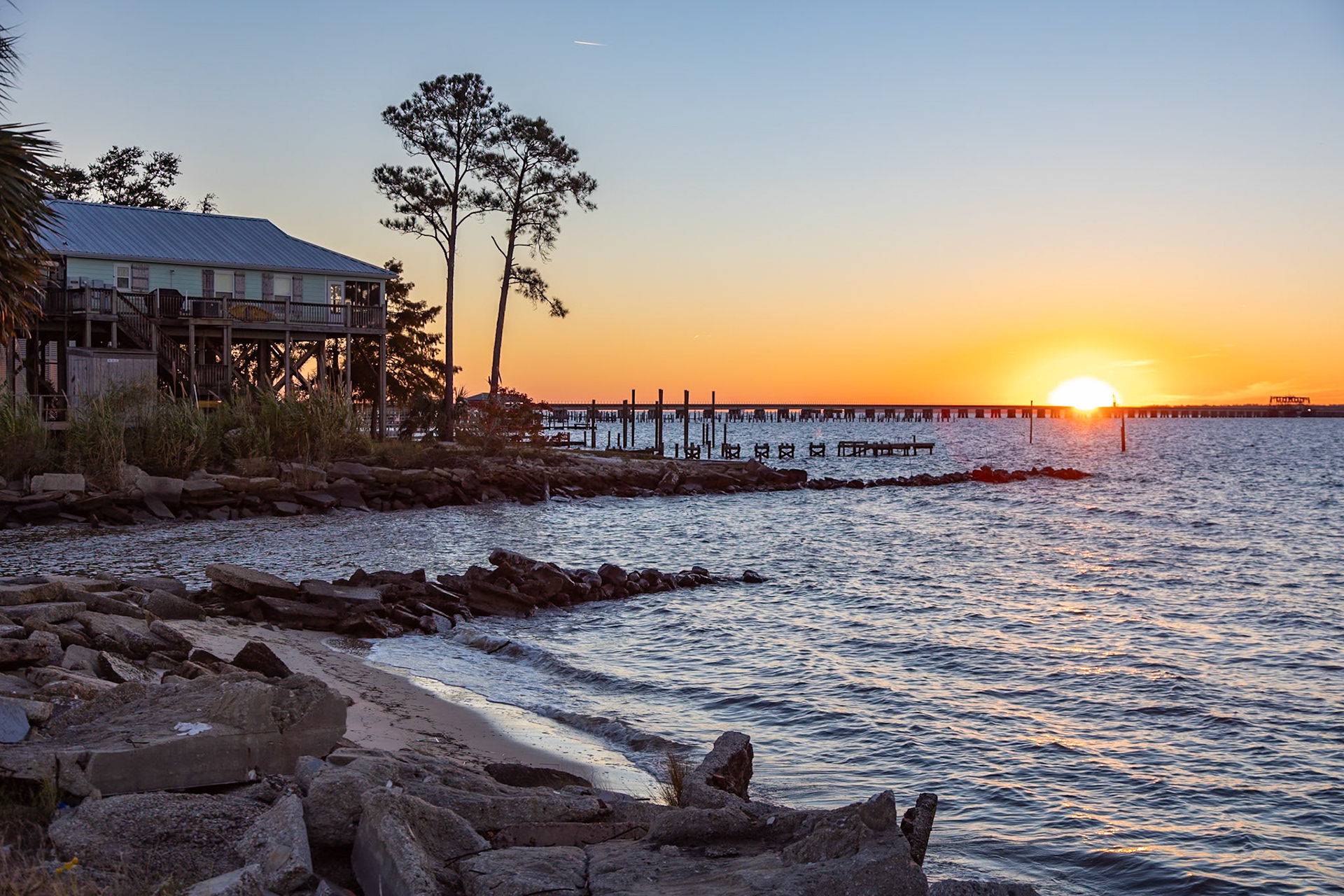 211113_428 Sunset over the railroad bridge across Bay of Saint Louis from Henderson Point in Pass Christian, Mississippi