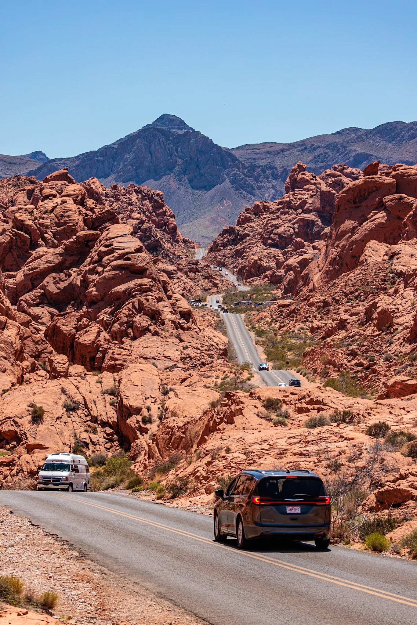 230330_273 Traffic on Mouse's Tank Road winds between the red sandstone rock formations in Valley of Fire State Park near Overton, Nevada