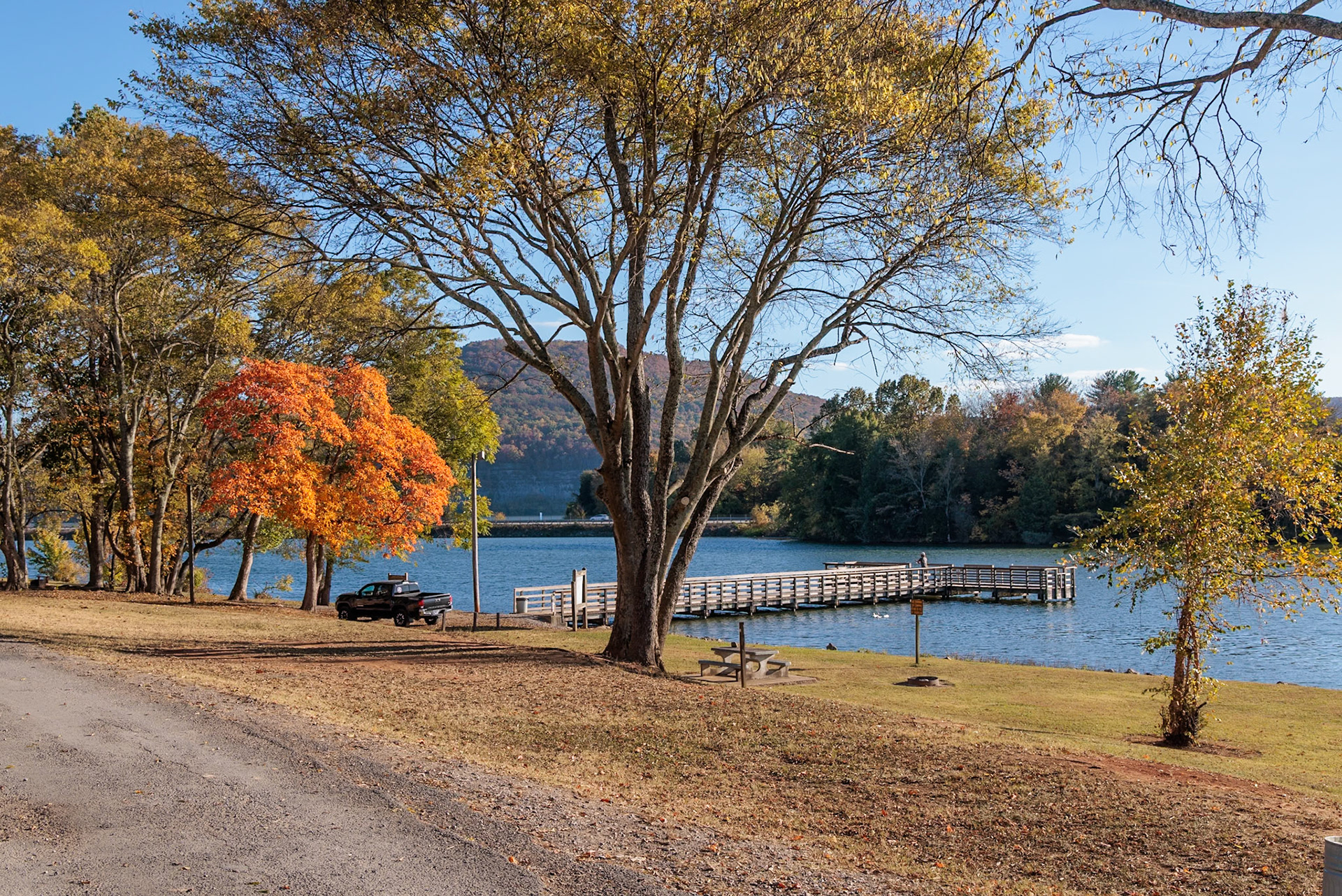 231025_025 Man fishing off the pier in Marion County Park on the shore of the Nickajack Lake in Jasper, Tennessee, USA