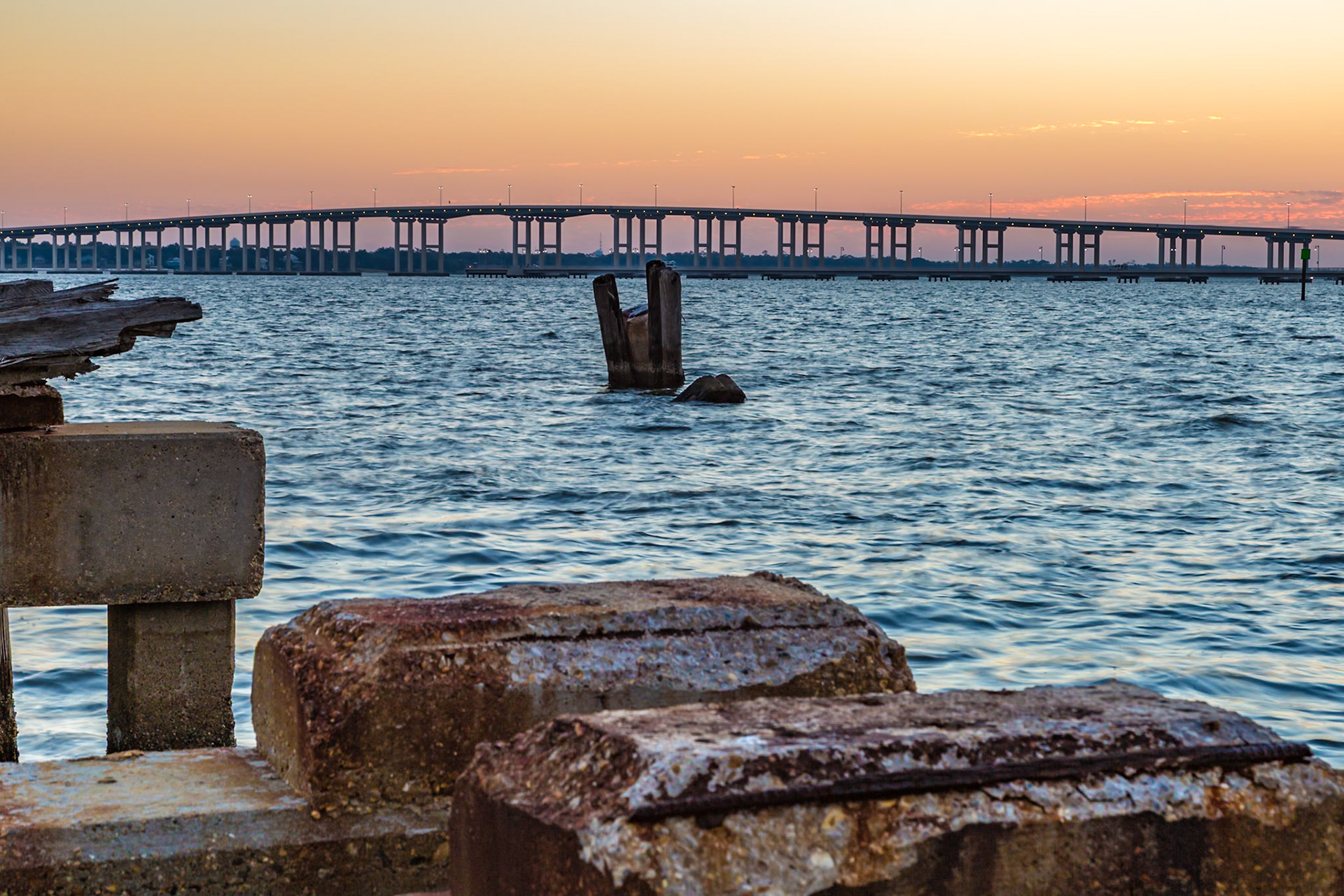 141122_008 Biloxi Bay Bridge behind the remains of an old gantry crane track on the Back Bay in Biloxi, Mississippi