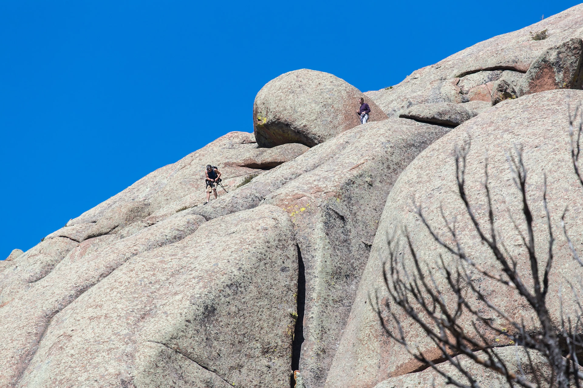180811_043 Man and woman rock climbing in the Vedauwoo Recreation Area of Medicine Bow National Forest in Wyoming
