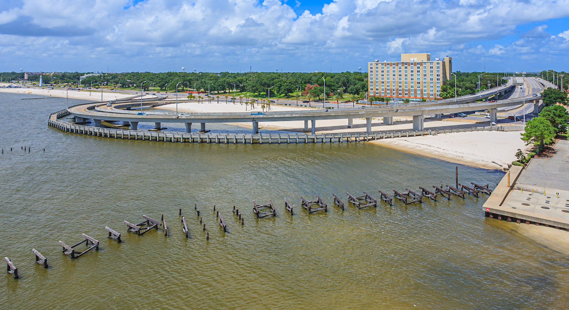 140901_048 Interstate I-110 ramps and boardwalk loop over the Mississippi Sound near remnants of a wooden fishing pier in Biloxi, MS
