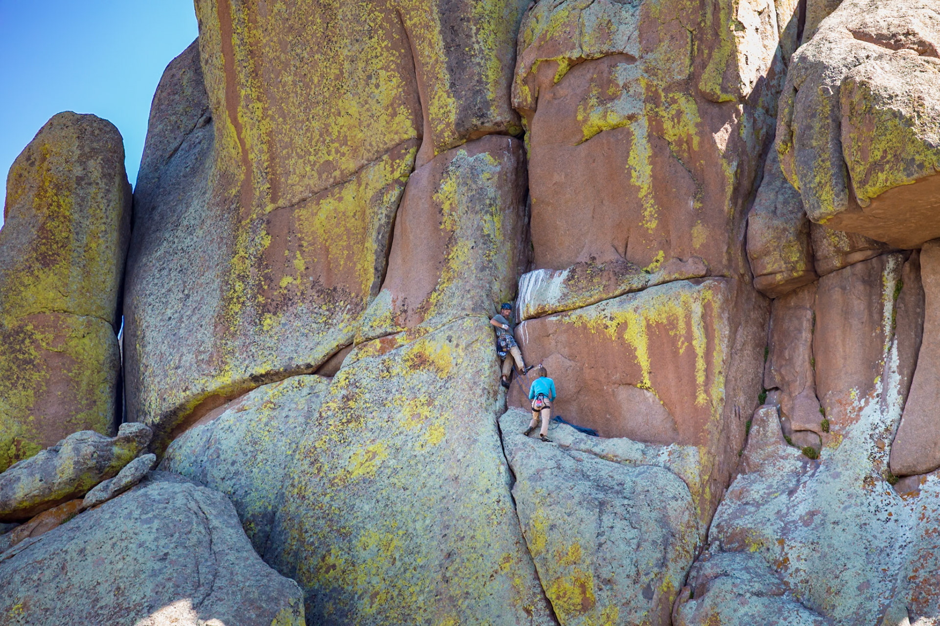 180811_021 Man and woman rock climbing in the Vedauwoo Recreation Area of Medicine Bow National Forest in Wyoming