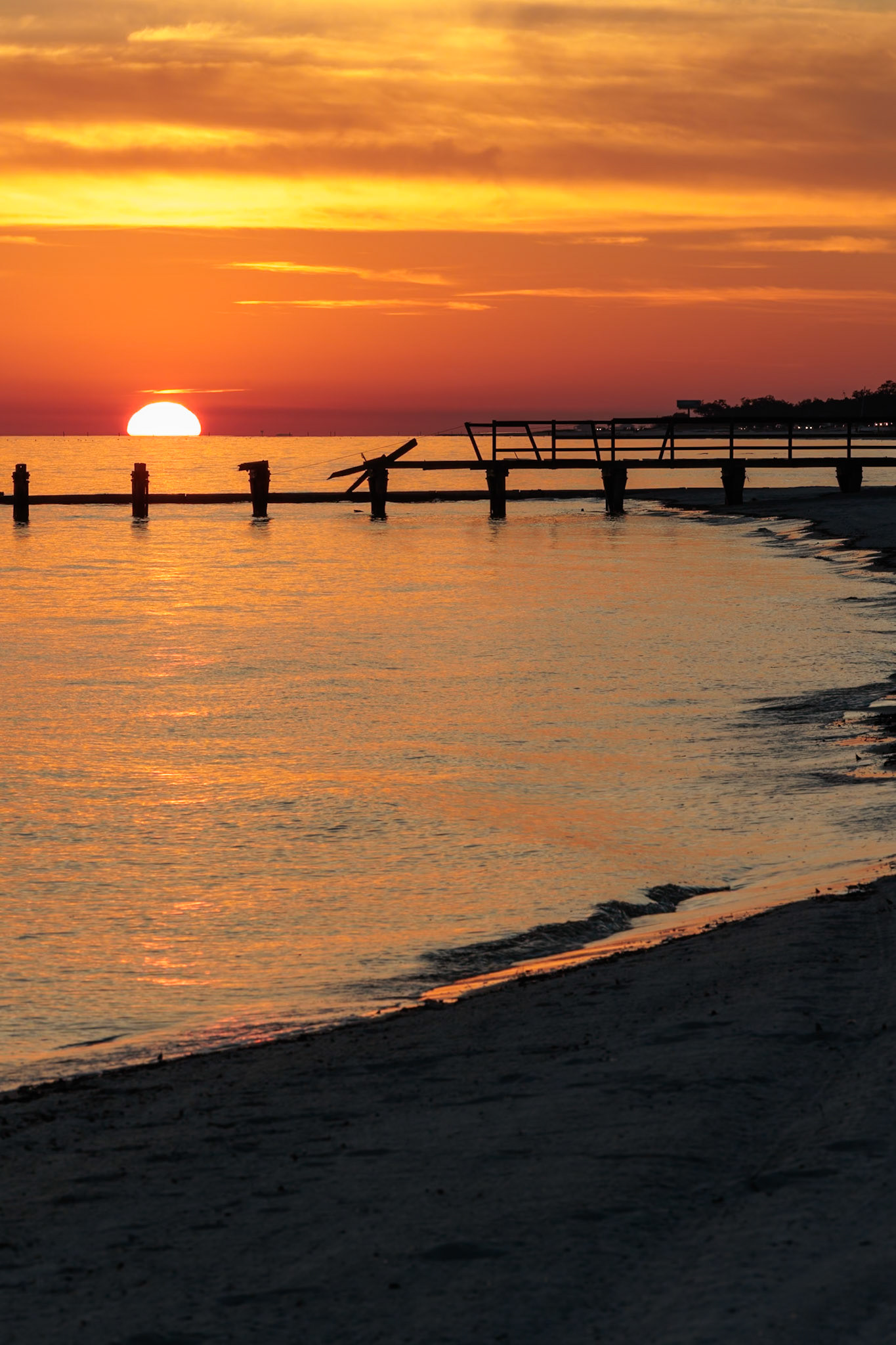 220114_212 Sunset behind dilapidated fishing pier damaged by hurricanes on the Mississippi Gulf Coast in Long Beach, Mississippi