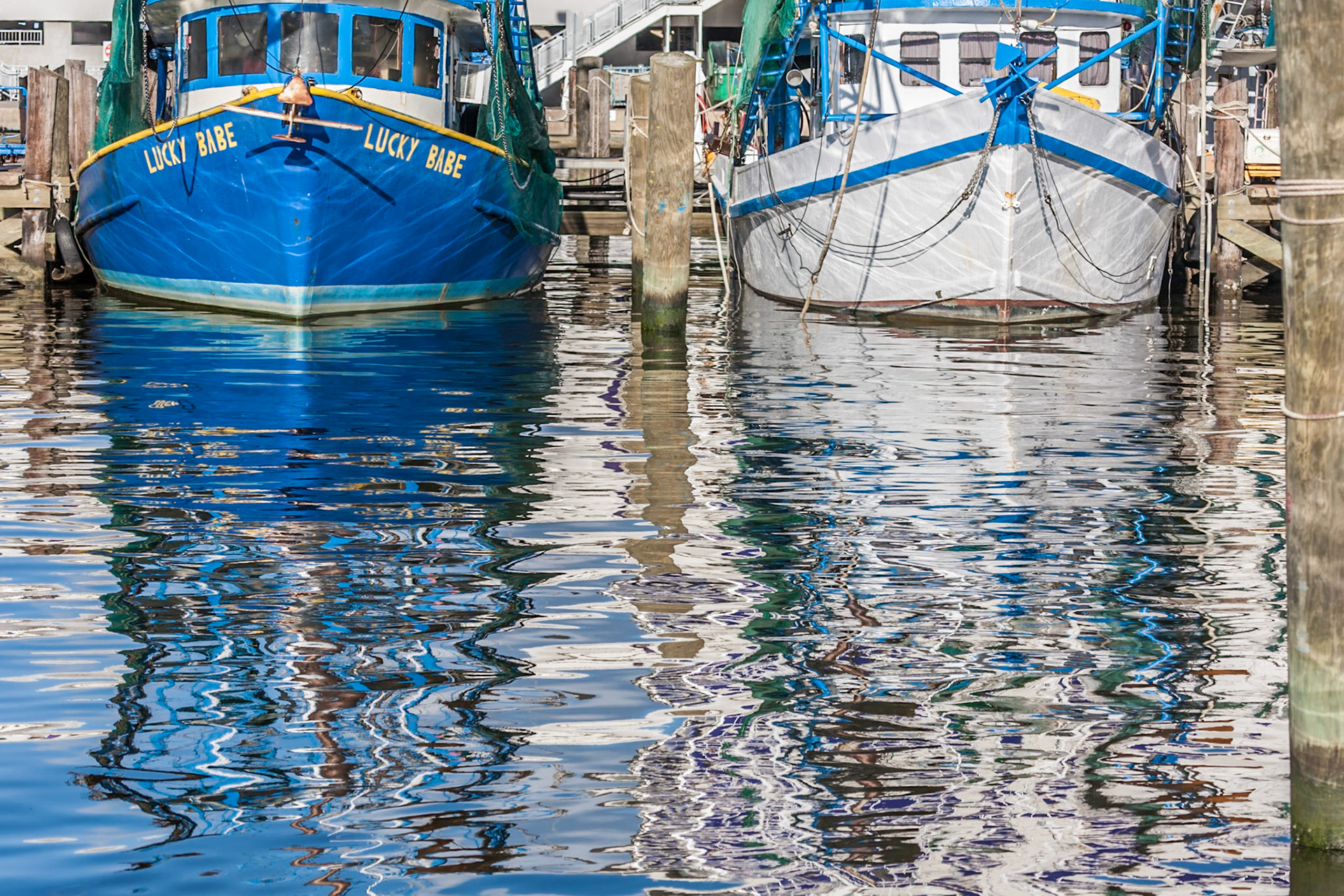 140911_022 Shrimp boats and their reflections at the Biloxi Small Craft Harbor in Biloxi, Mississippi