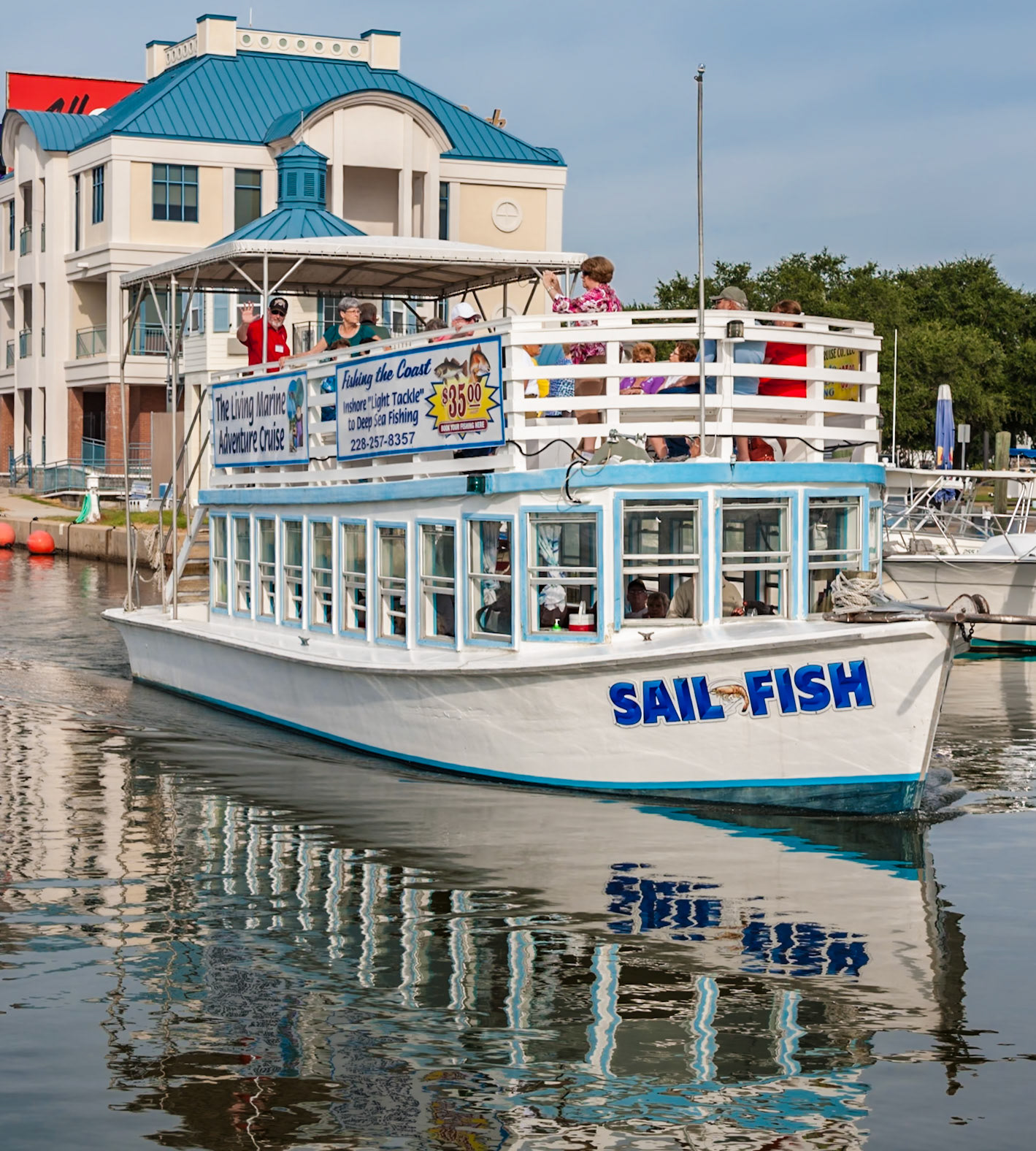 140917_083 Tourists leaving for a boat tour on the Sail Fish tour boat in the Biloxi Small Craft Harbor at Biloxi, Mississippi