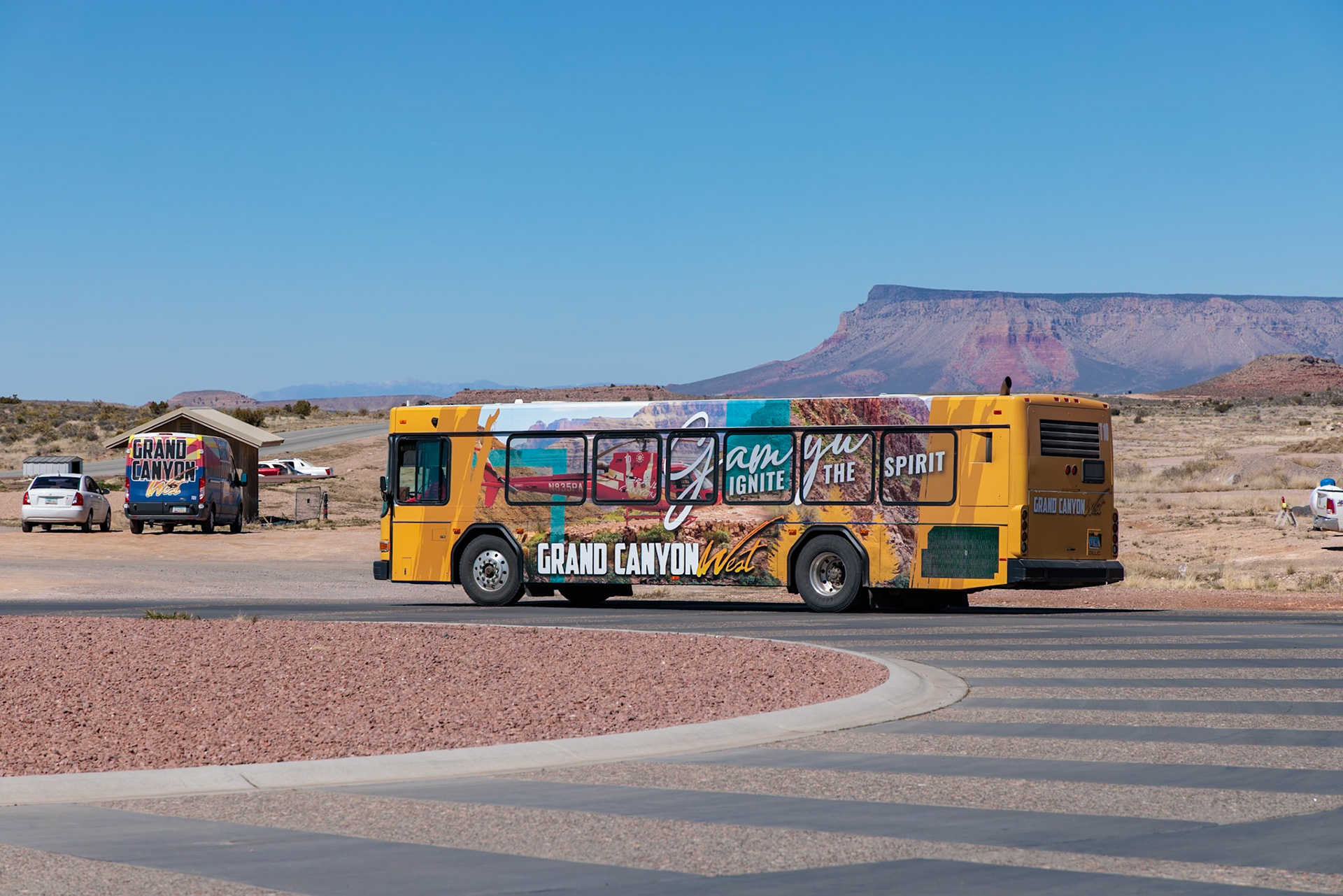 230405_108 Colorful wrapped busses transport guests to attractions at Grand Canyon West near Peach Springs, Arizona