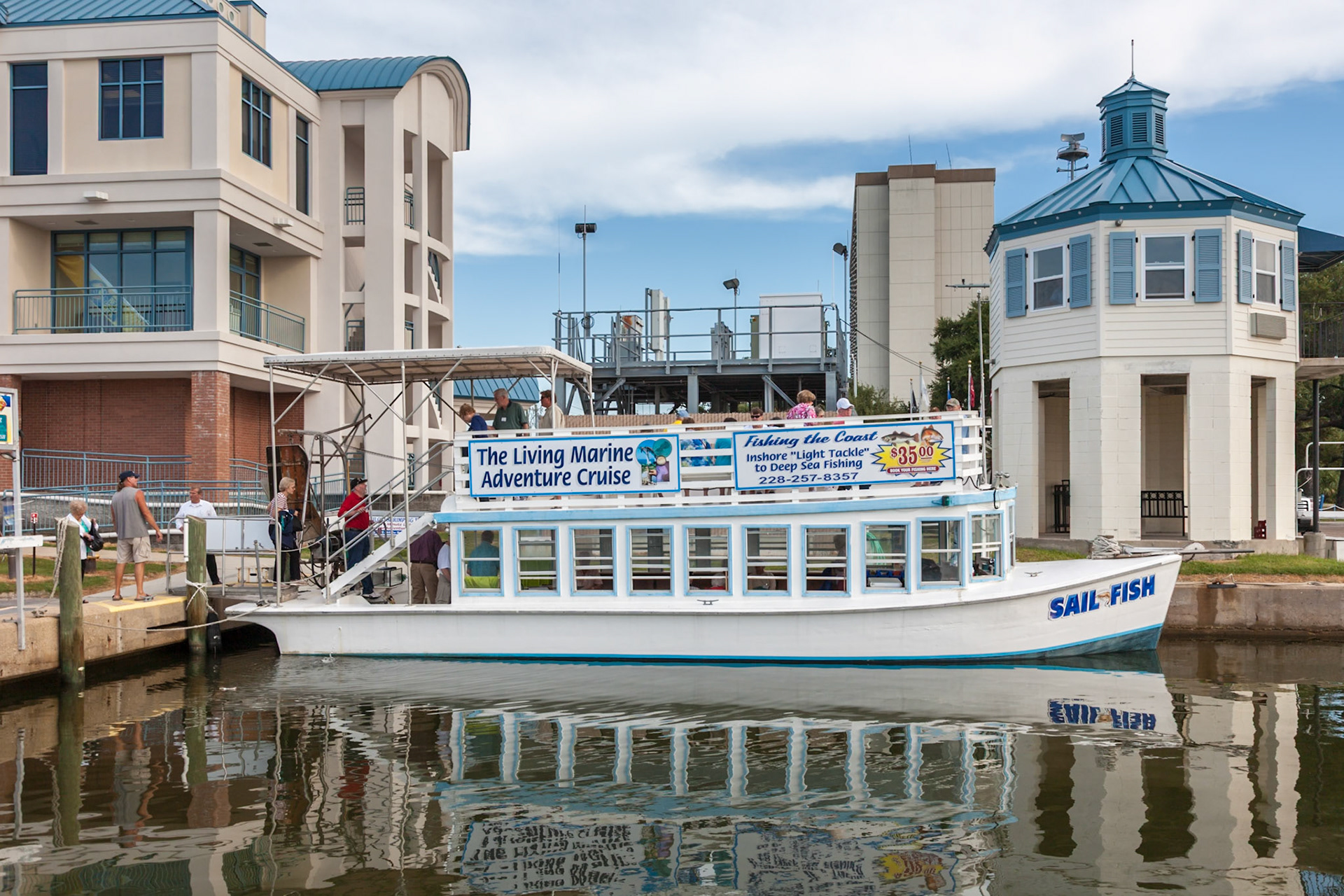 140917_075 Tourists boarding the Sail Fish tour boat in the Biloxi Small Craft Harbor at Biloxi, Mississippi