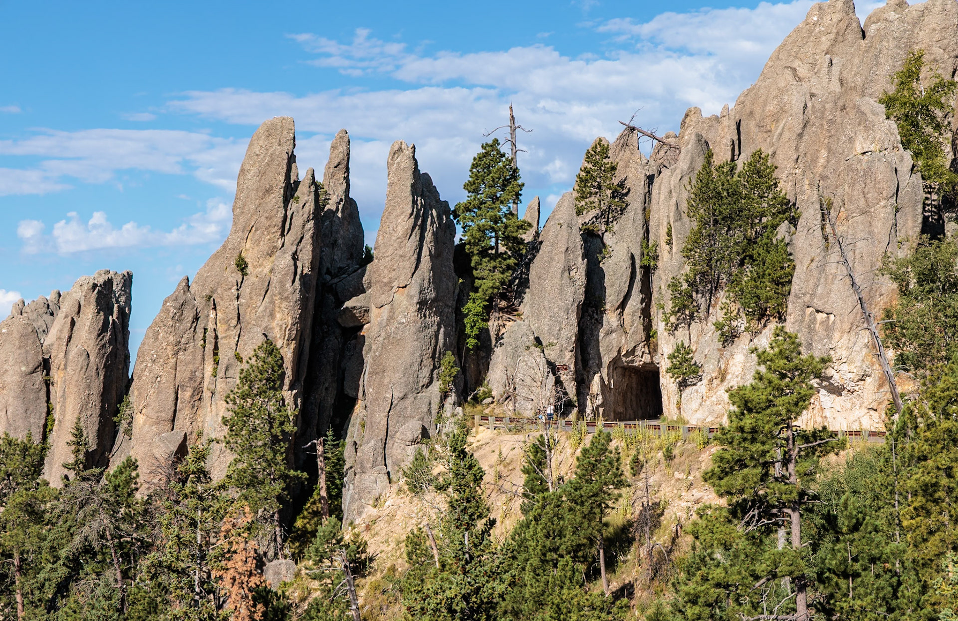 240821_104 Needles Eye Tunnel cut through the rock formations in Custer State Park, South Dakota, USA