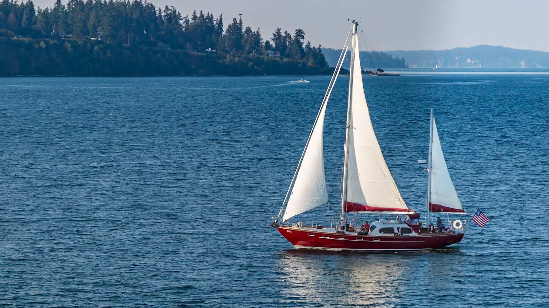 180906_081 Red sailboat under way in the Puget Sound near Bainbridge Island, Washington