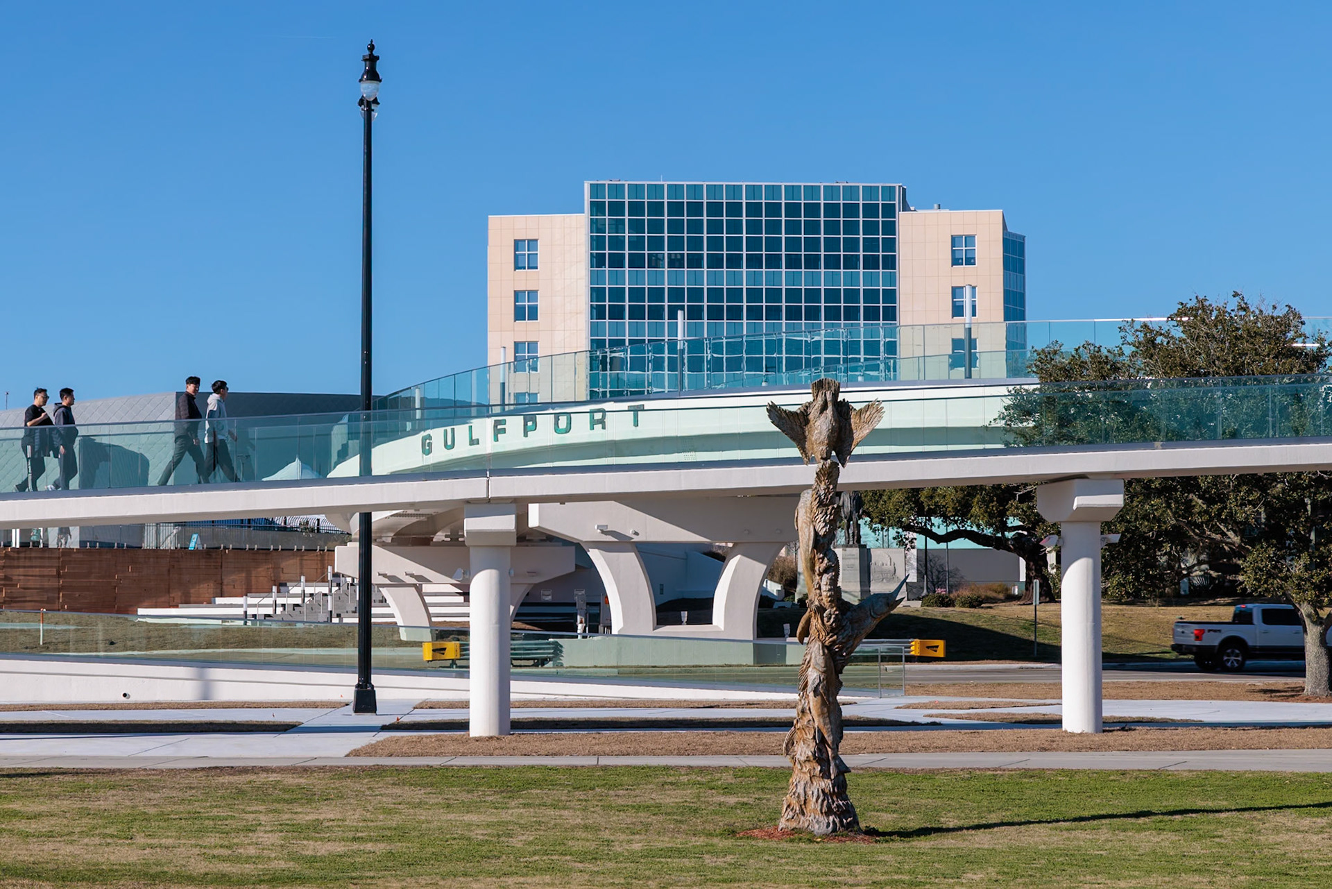 240131_001 Jones Park visitors walking on new pedestrian bridge that takes people across Highway 90 to the Mississippi Aquarium