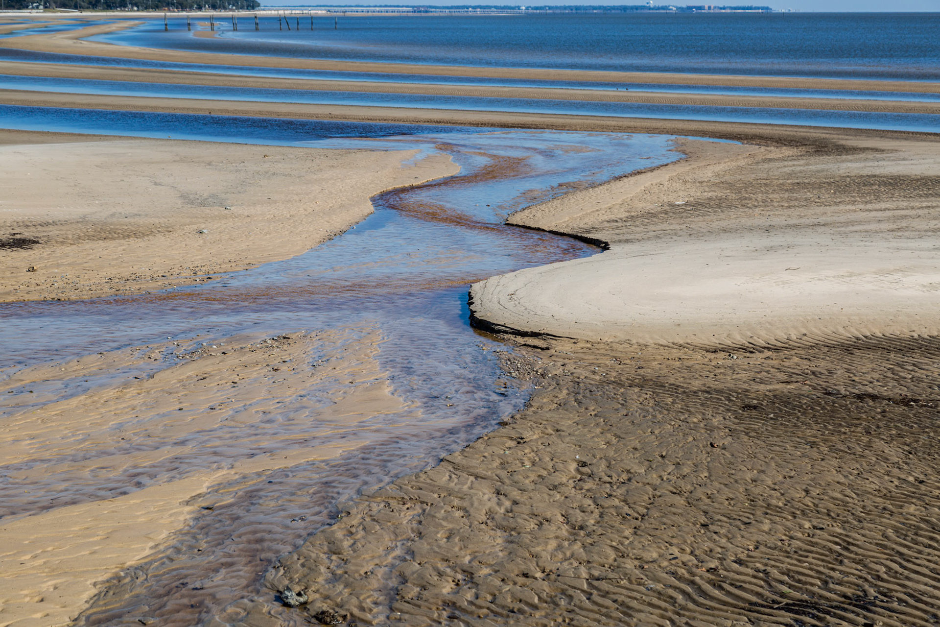 160123_017 Sand beach exposed in bands during low tide of the Gulf of Mexico at Waveland, Mississippi