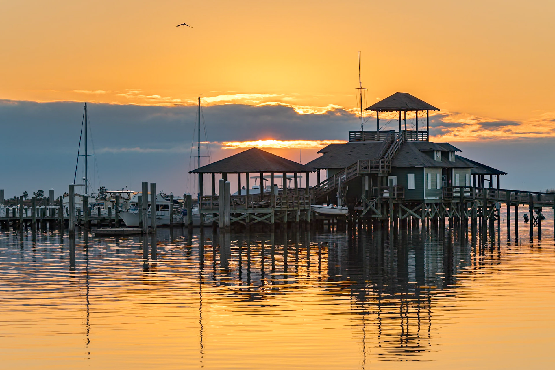 220107_034 Biloxi Schooner Pier Complex at sunset on the Gulf of Mexico at Biloxi, Mississippi, USA
