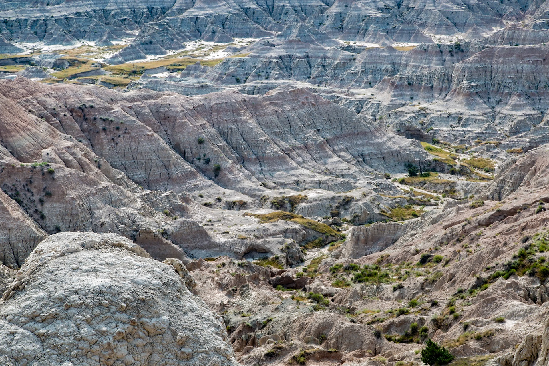 180816_162 Dry riverbed in the bottome of a deep canyon in the Badlands National Park in South Dakota, USA