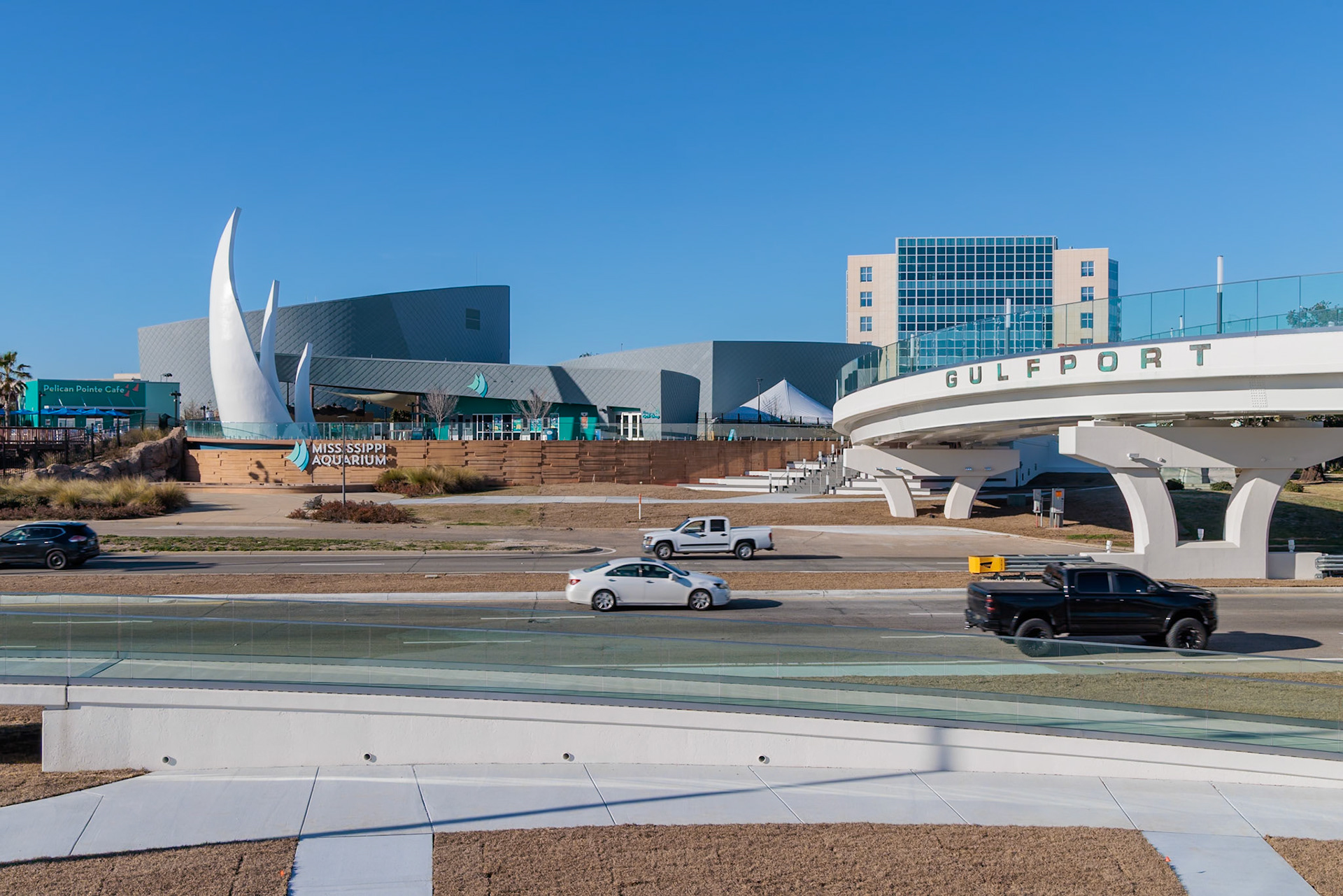 240131_014 Pedestrian and tram bridge carries visitors from Jones Park across Highway 90 to the Mississippi Aquarium in Gulfport, Mississippi