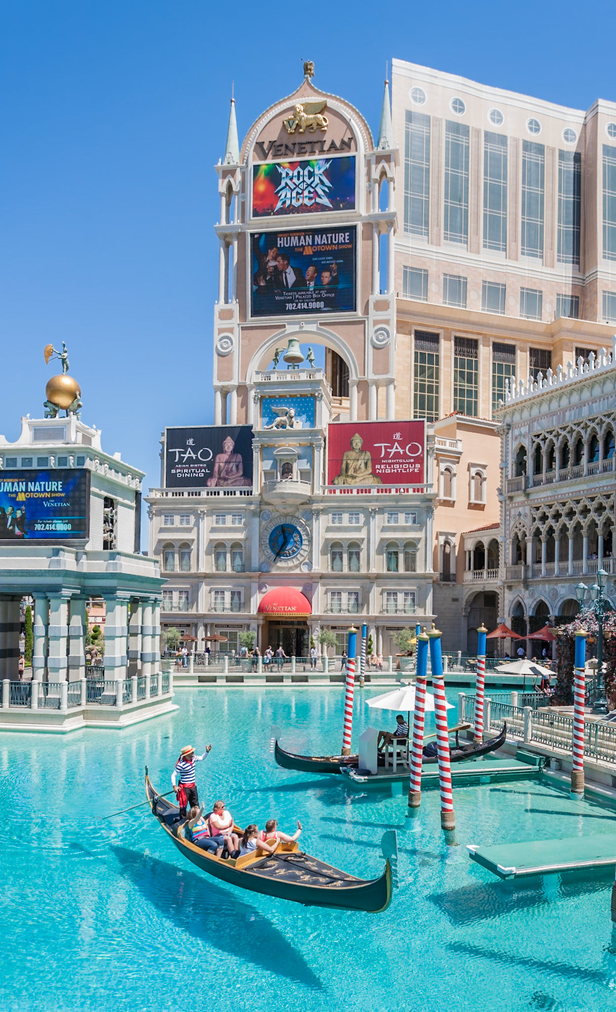140502_652 Gondoliers carry tourist passengers on gondola rides at the Venetian Resort Hotel Casino on the Las Vegas Strip in Paradise, Nevada