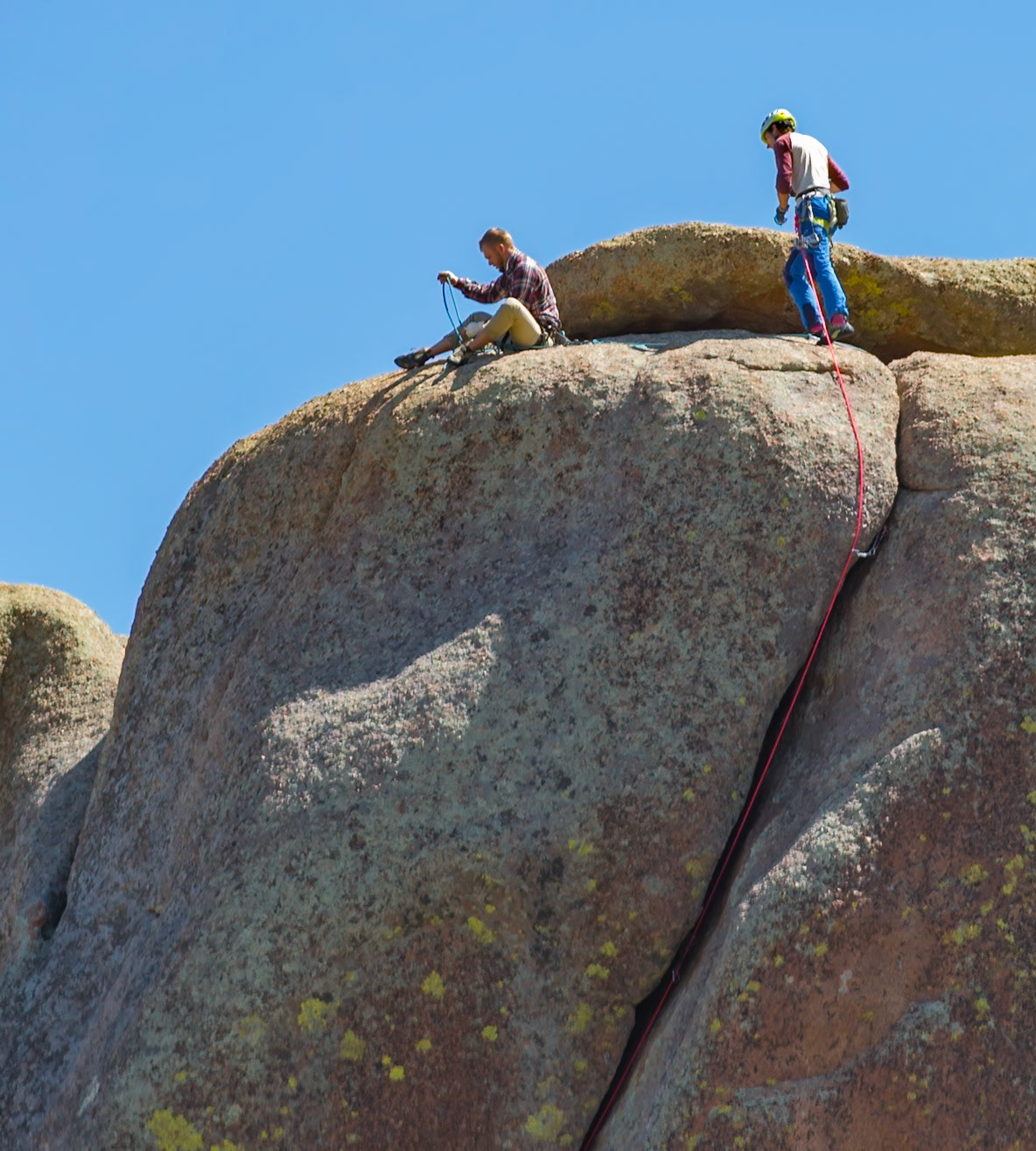 180811_074 Two men rock climbing on a large granite boulder in the Vedauwoo Recreation Area of Medicine Bow National Forest in Wyoming