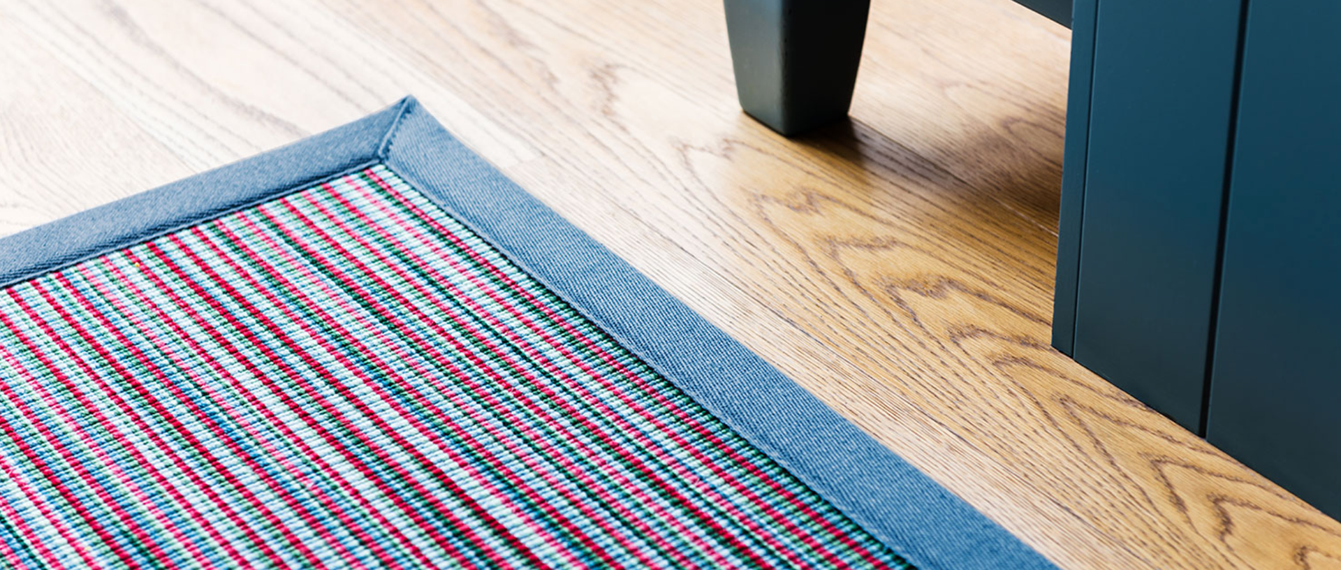 Wool Longitude Antigua rug with Ocean Blue Linen boarder