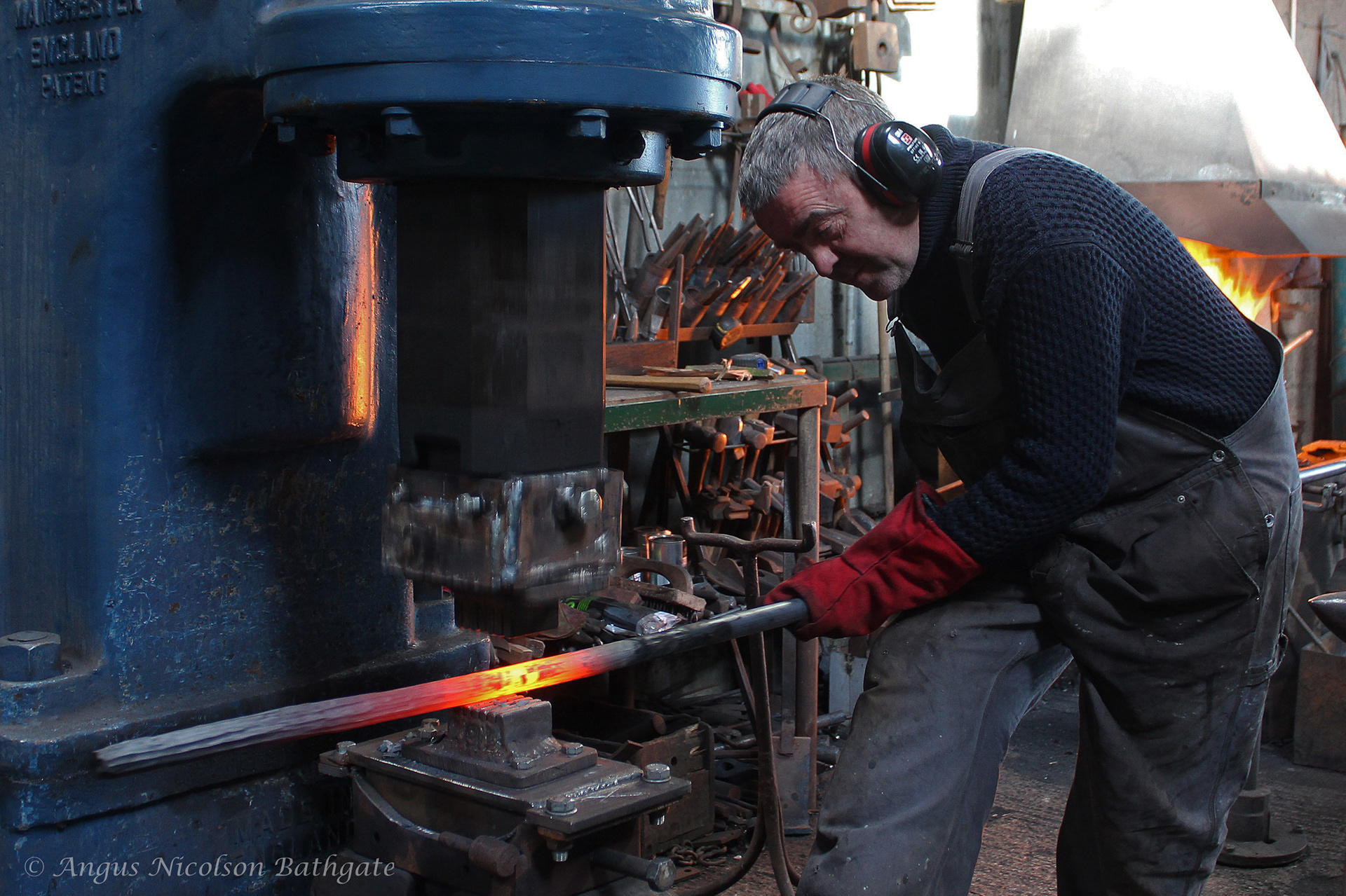 R. Douglas Blacksmith forging a new creation