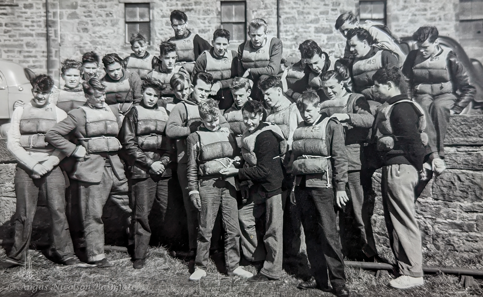 Burghead 1958. Angus sitting on wall 2nd right
