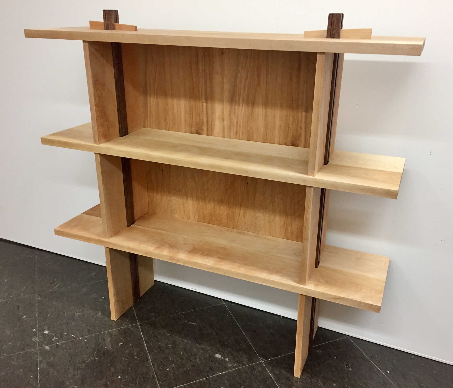 In order to highlight its significance, the tenon bar is the only member with a degree of ornamentation—dark staining, shallow grooves and chamfered corners