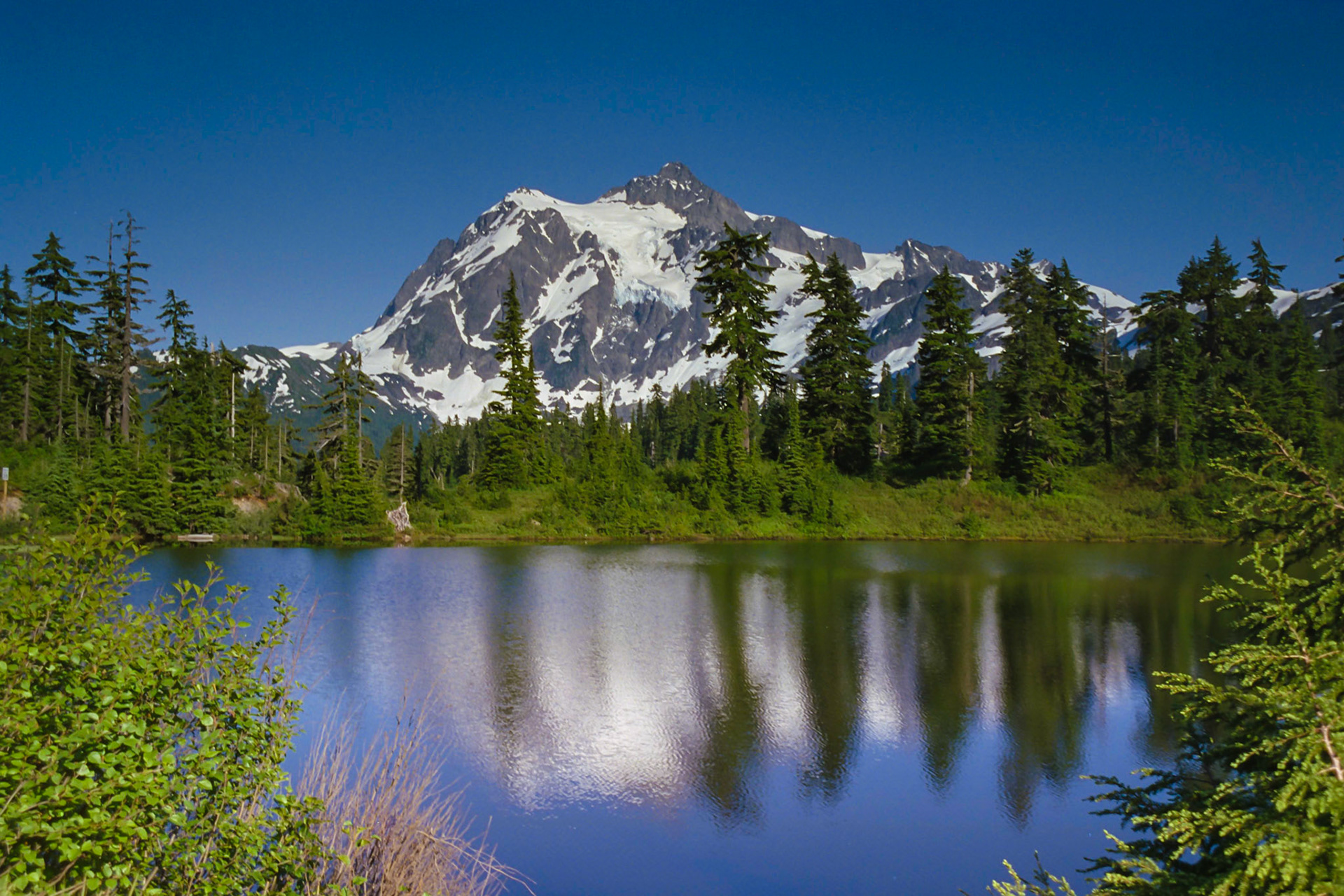 Mount Shuksan reflected in Highwood Lake in the Cascade Mountains. This photo was taken from Mount Baker-Snoqualmie National Forest in June of 1996. I was in Washington for some backpacking and then the wedding of close family friend.