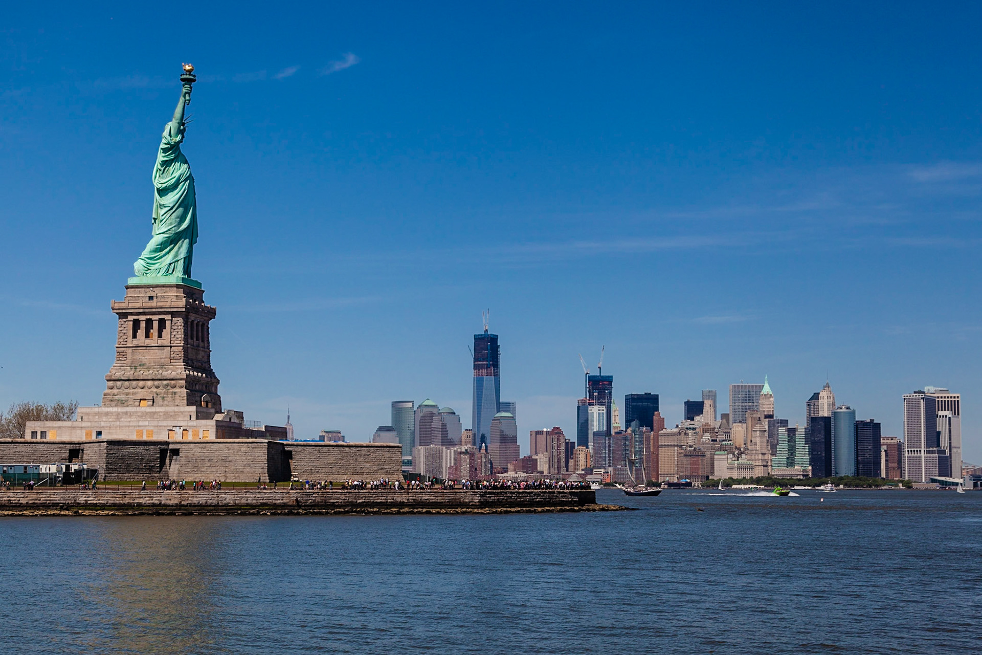 Statue of Liberty and The World Trade Center in the background (under construction in 2012)