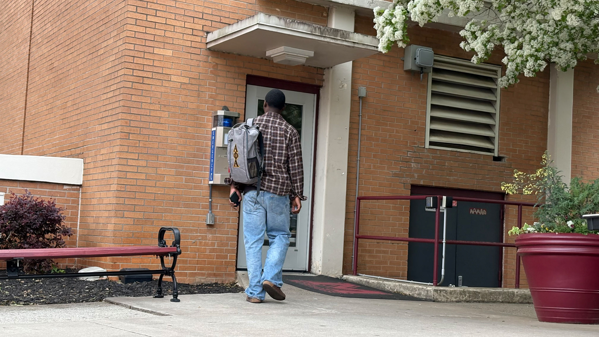 JUST A STUDENT Walking into his 6 p.m. class, Chris' busyness is still centered around academic obligations. Despite all the titles, accolades, and affiliations, he is a man of Morehouse like the rest of us. (Photo/Noah Cathey)