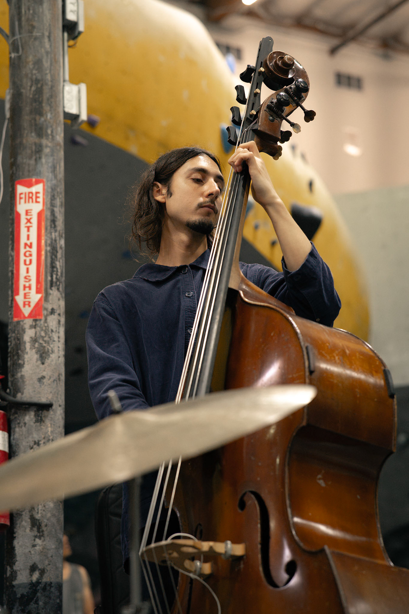 Dario Bizio playing on the double bass. Photographed by Francisco Santiago on 2025.05.28 at LA Boulders in Los Angeles, CA. Shot using a Sony A7III.