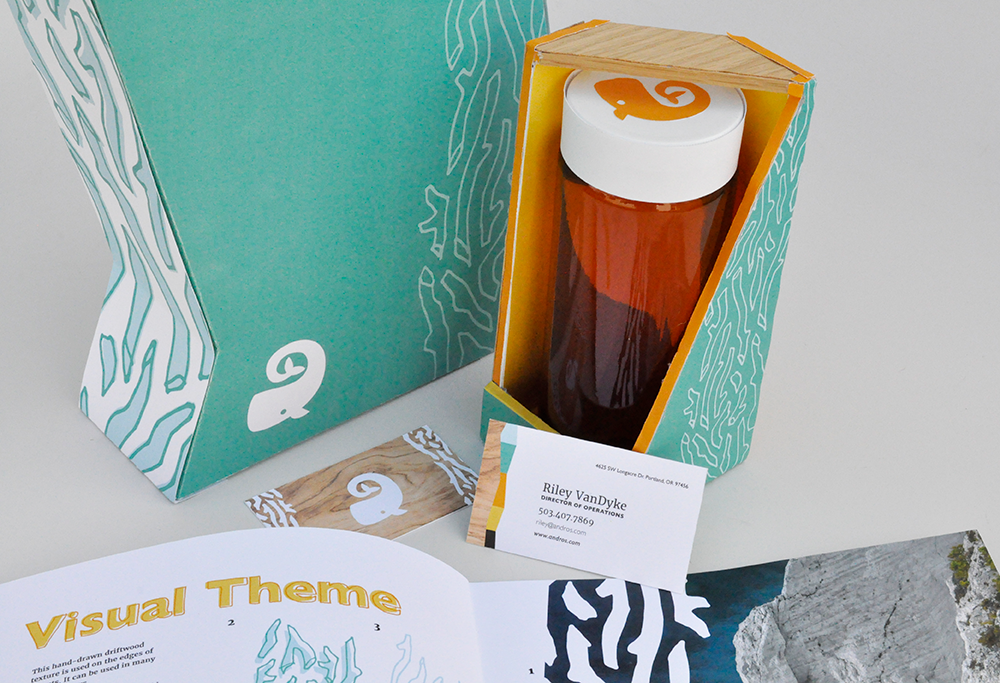 Andros bag, gifted honey, business cards, and brand book