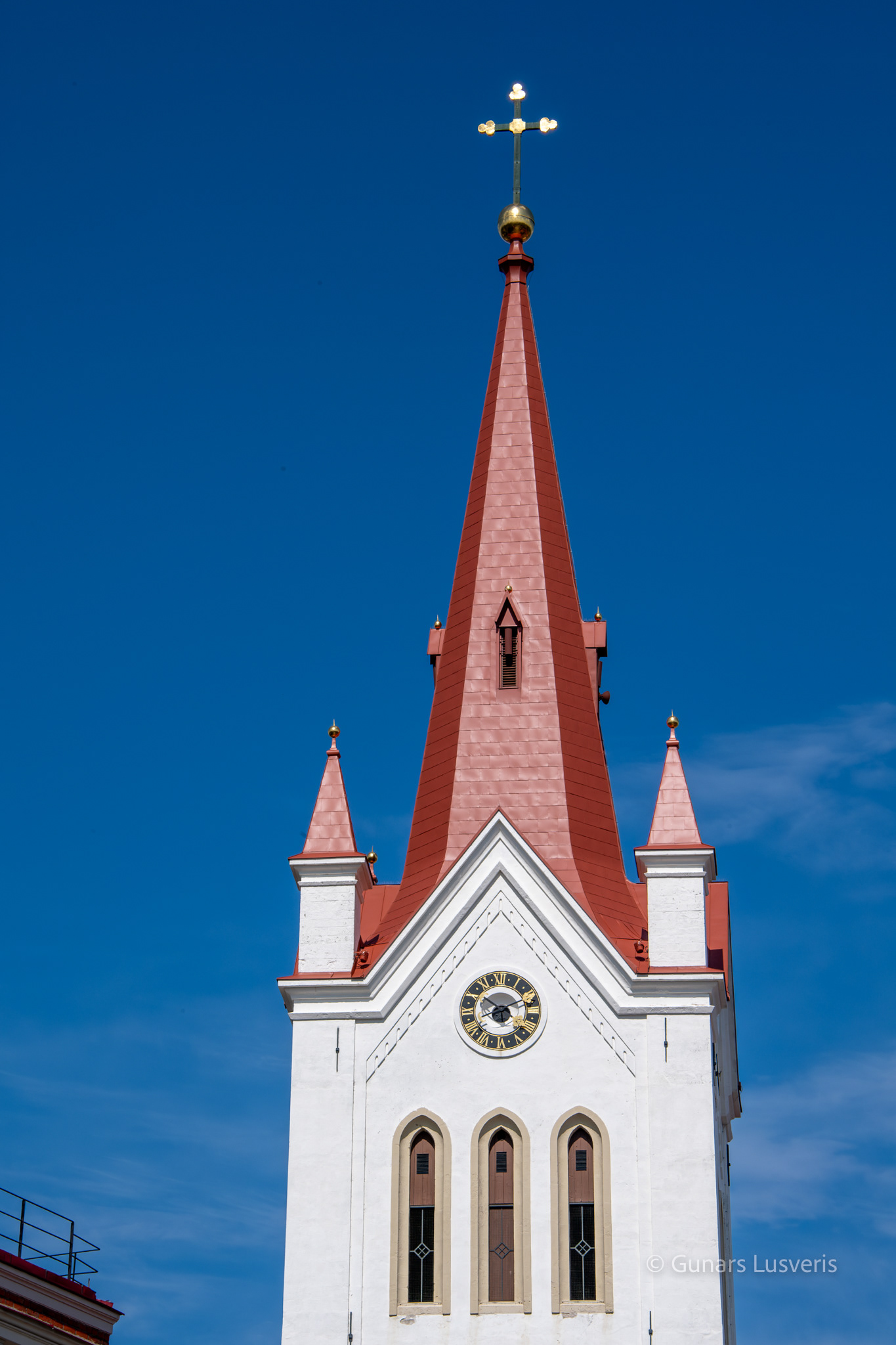 The church is a three-bay basilica 65m long and 32m wide, at its western end is a massive 65m high bell tower with a Gothic spire. The church is designed for 500 seats.