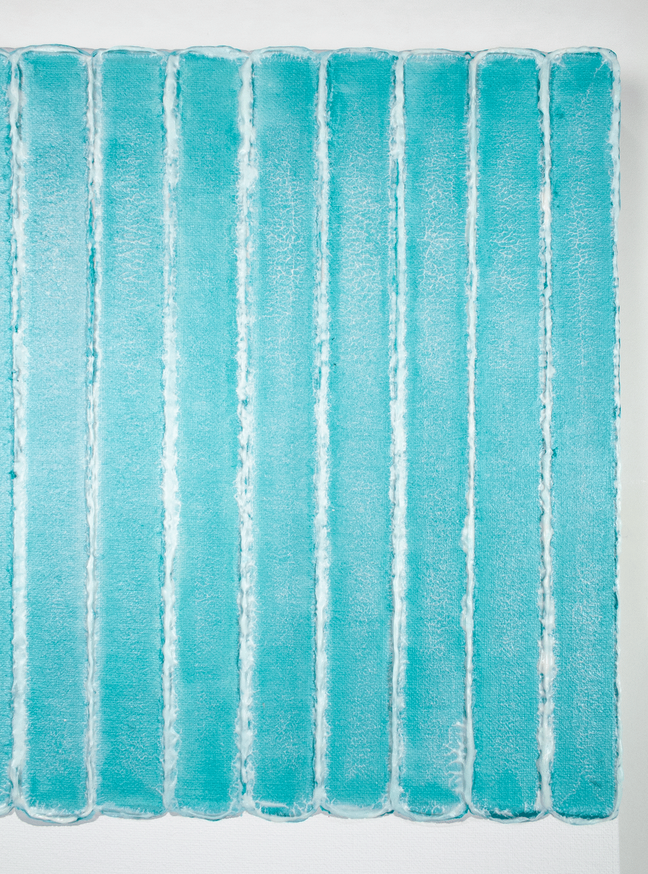 A detail of a textured abstract painting by contemporary Dutch artist Maurice van Venrooij, featuring vertical turquoise lines with rough, white edges on a crisp white canvas. The artwork's structured yet organic design creates a sense of rhythm and depth, highlighting Van Venrooij’s unique approach to abstract art.