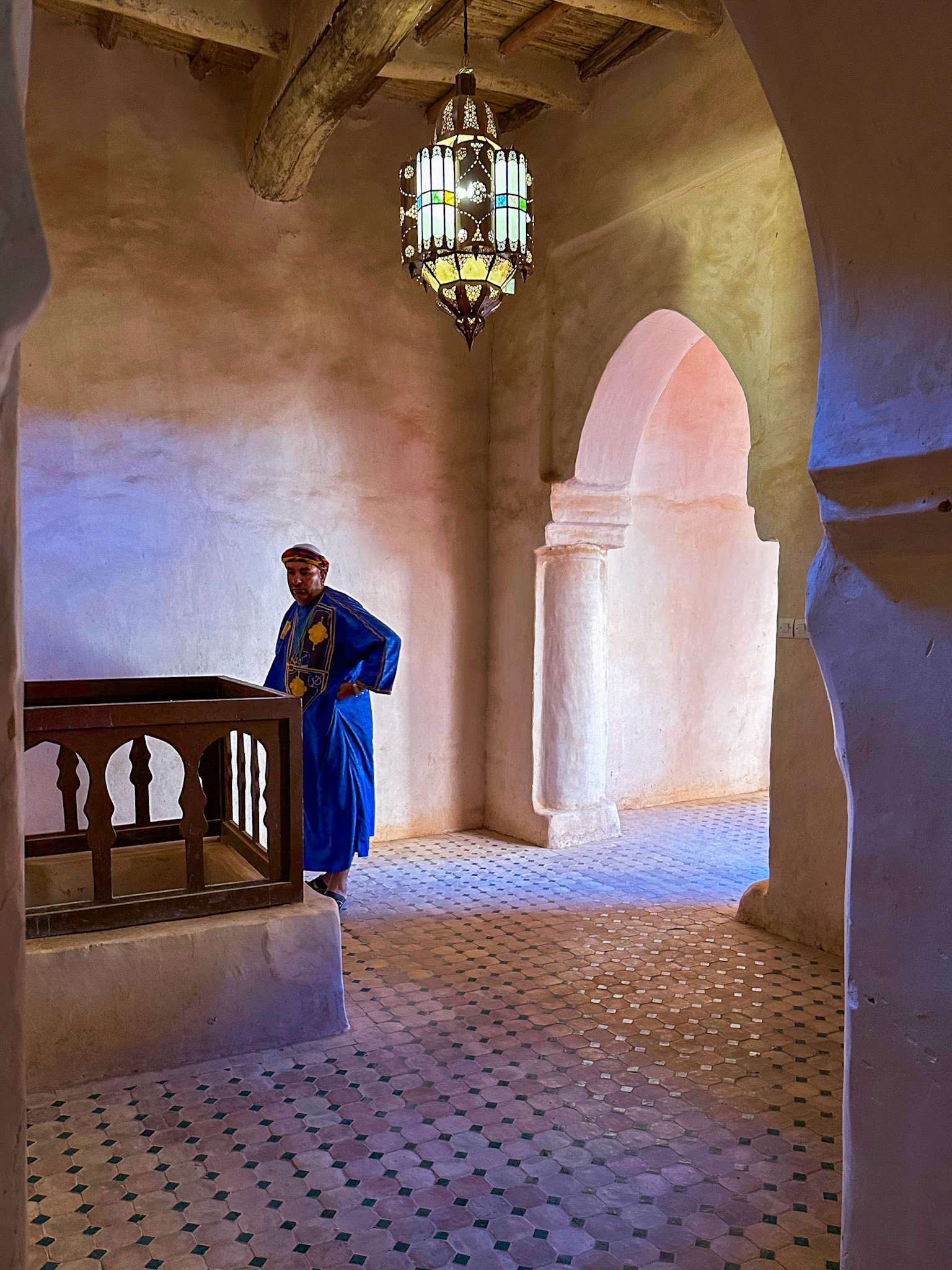 Interior Taourirt Kasbah with Man in Traditional Garb