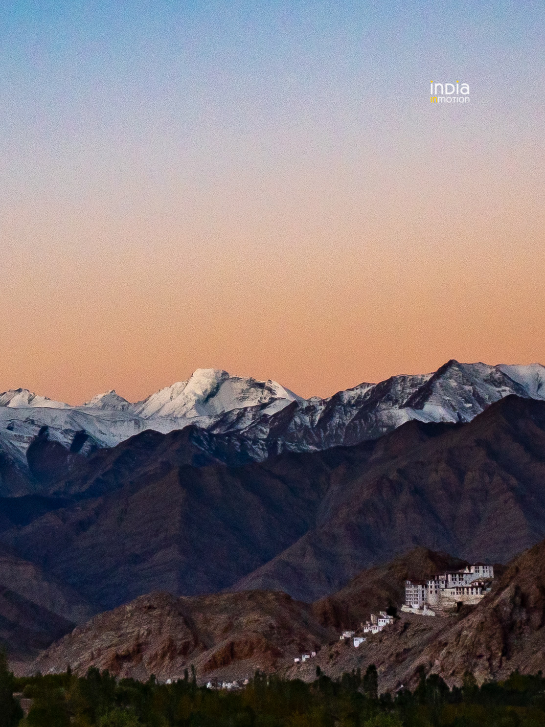 A colorful sunrise behind the Chemrey Monastery