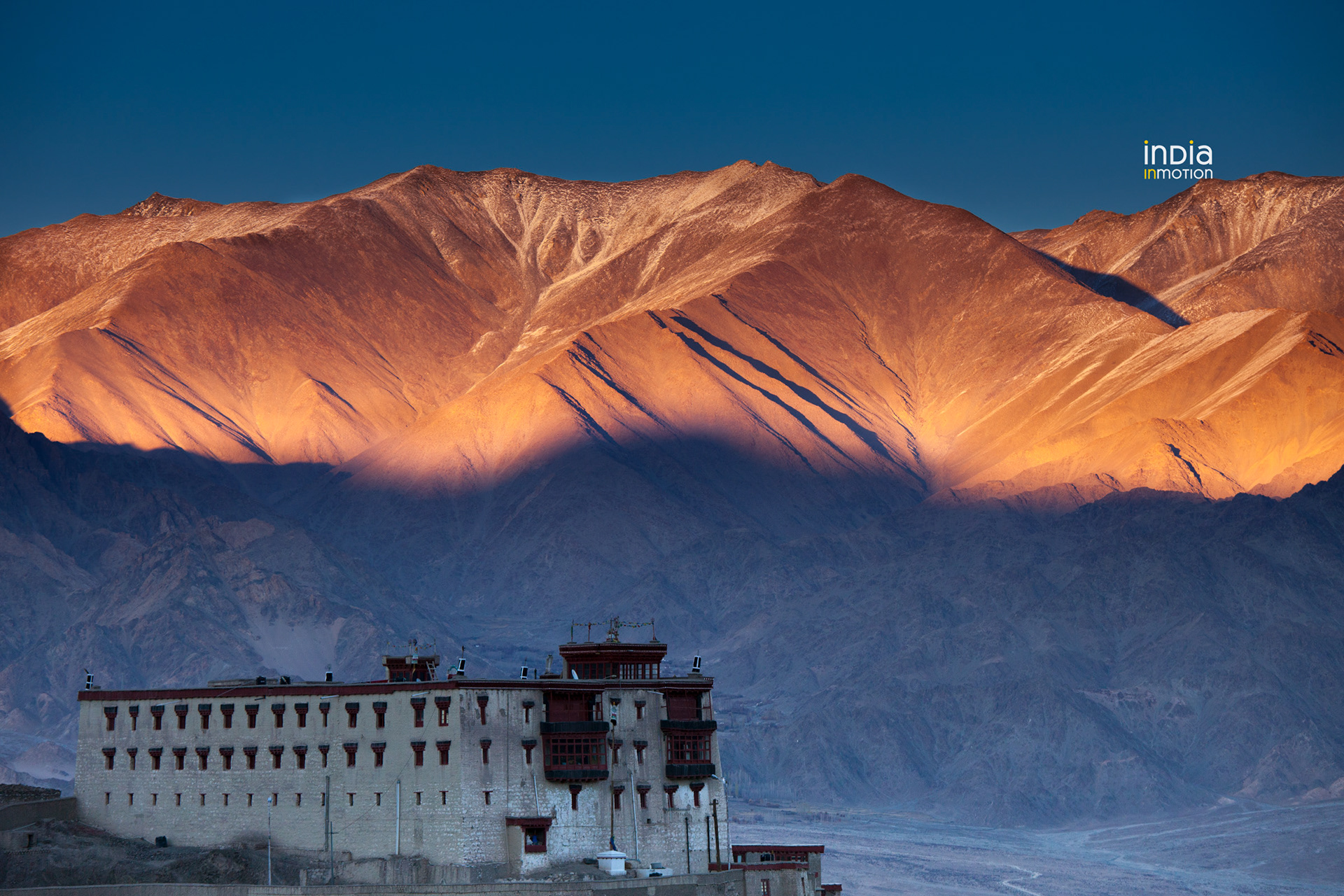 A colourful sunset behind the Stok Palace in Ladakh