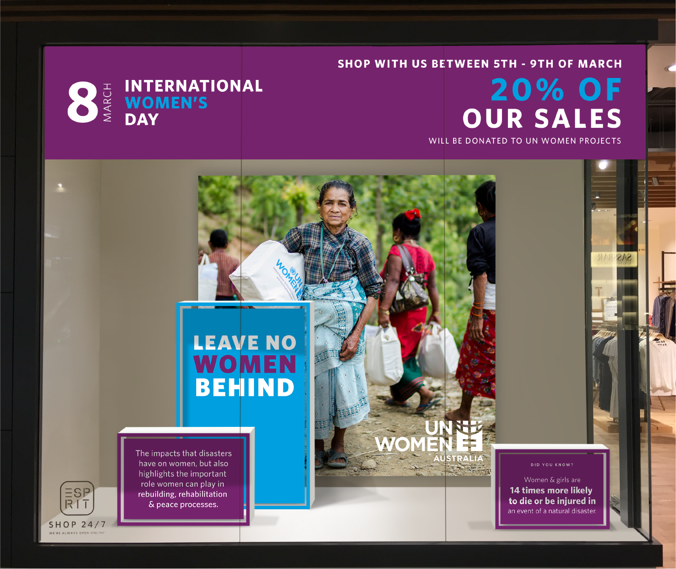 Window display for International Women's Day featuring a promotion by Esprit, highlighting UN Women's Australia projects. The display includes the message 'Leave No Women Behind' with an image of a woman carrying a UN Women package. A banner indicates that 20% of sales between 5th-9th March will be donated to UN Women projects.