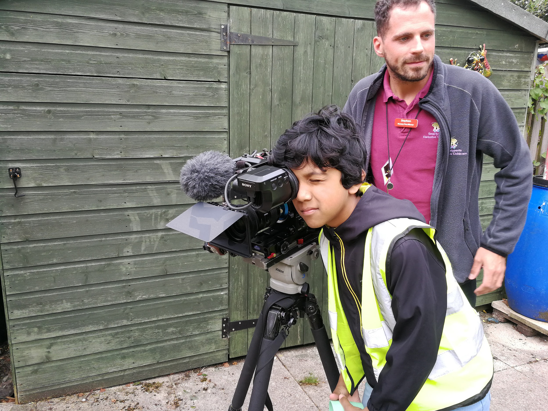 Young person checks out the shot